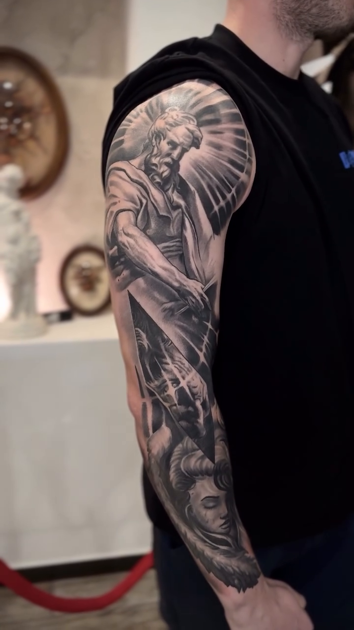 Religious figures and mechanical elements realism tattoo by Tony Ink
