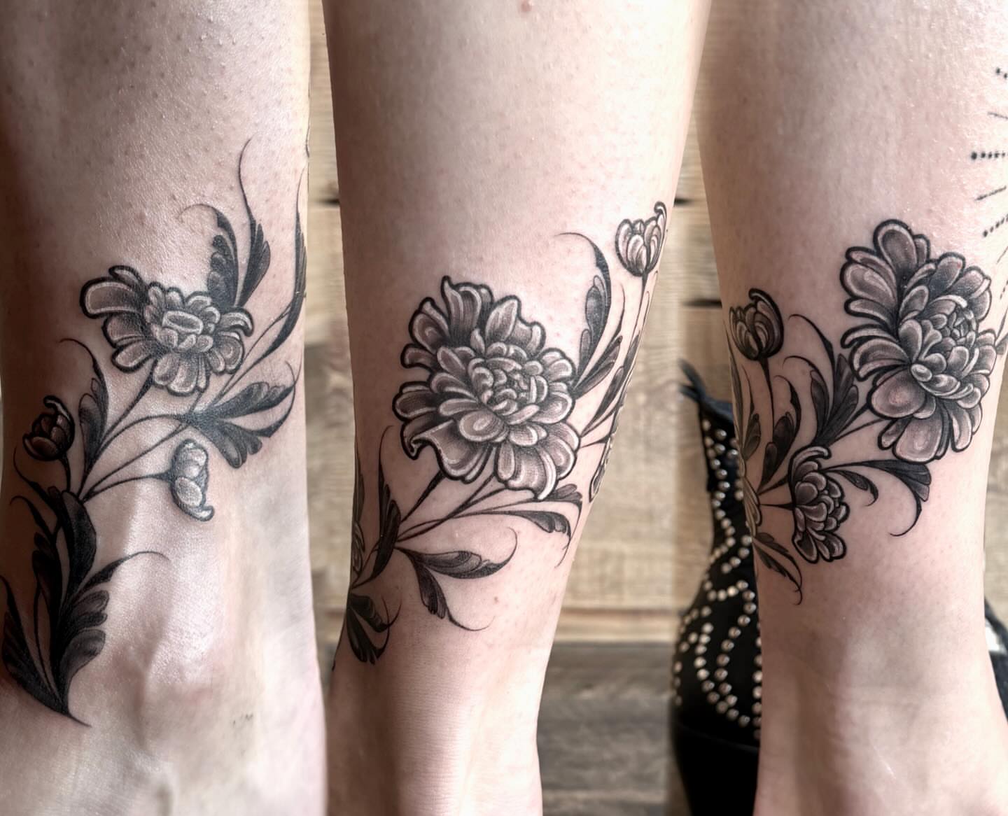 Chrysanthemum black and grey tattoo on the calf by Heather Syvilla Tattoos