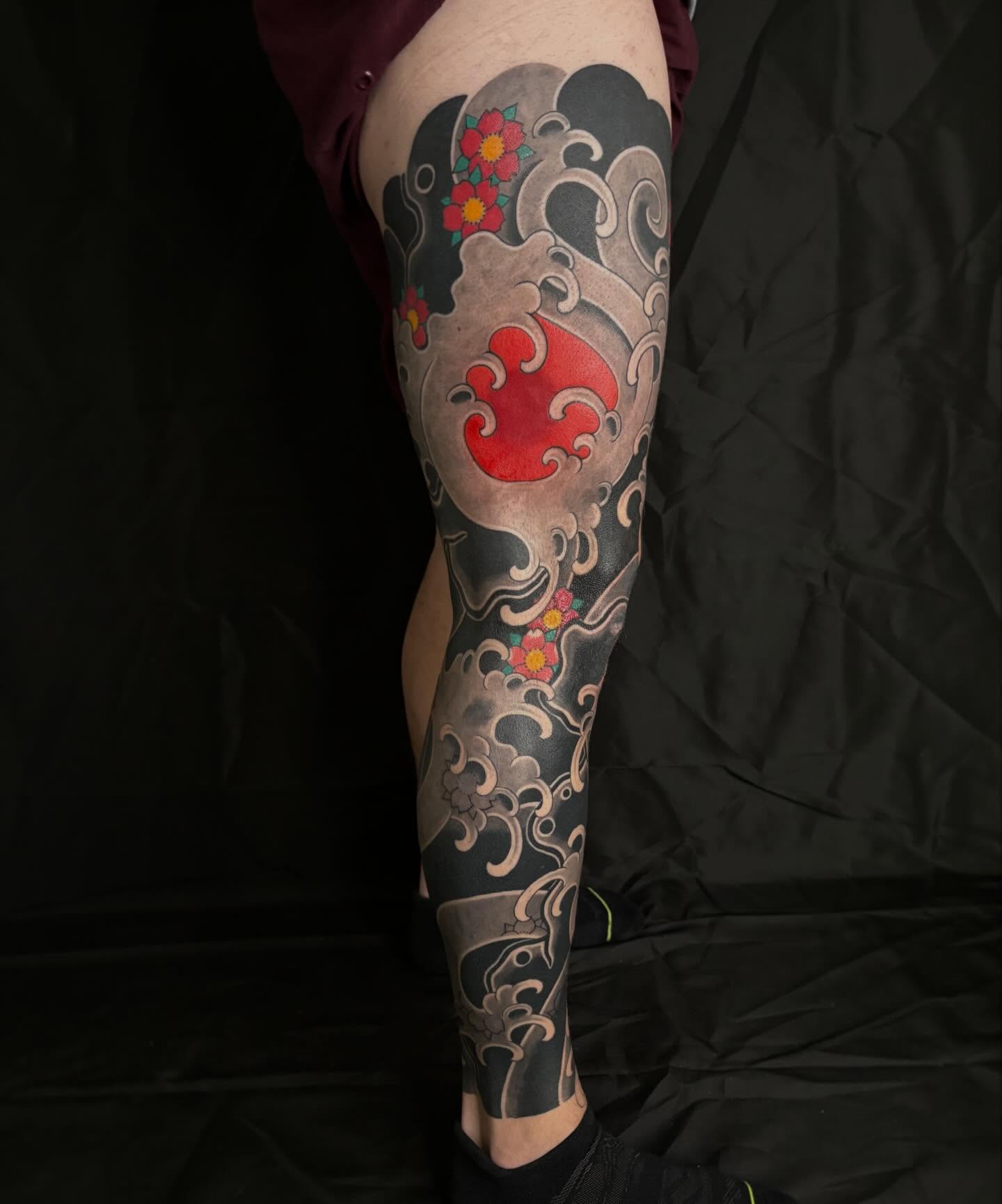 Wave and cherry blossoms japanese irezumi tattoo on the forearm by Zach Hendrickson