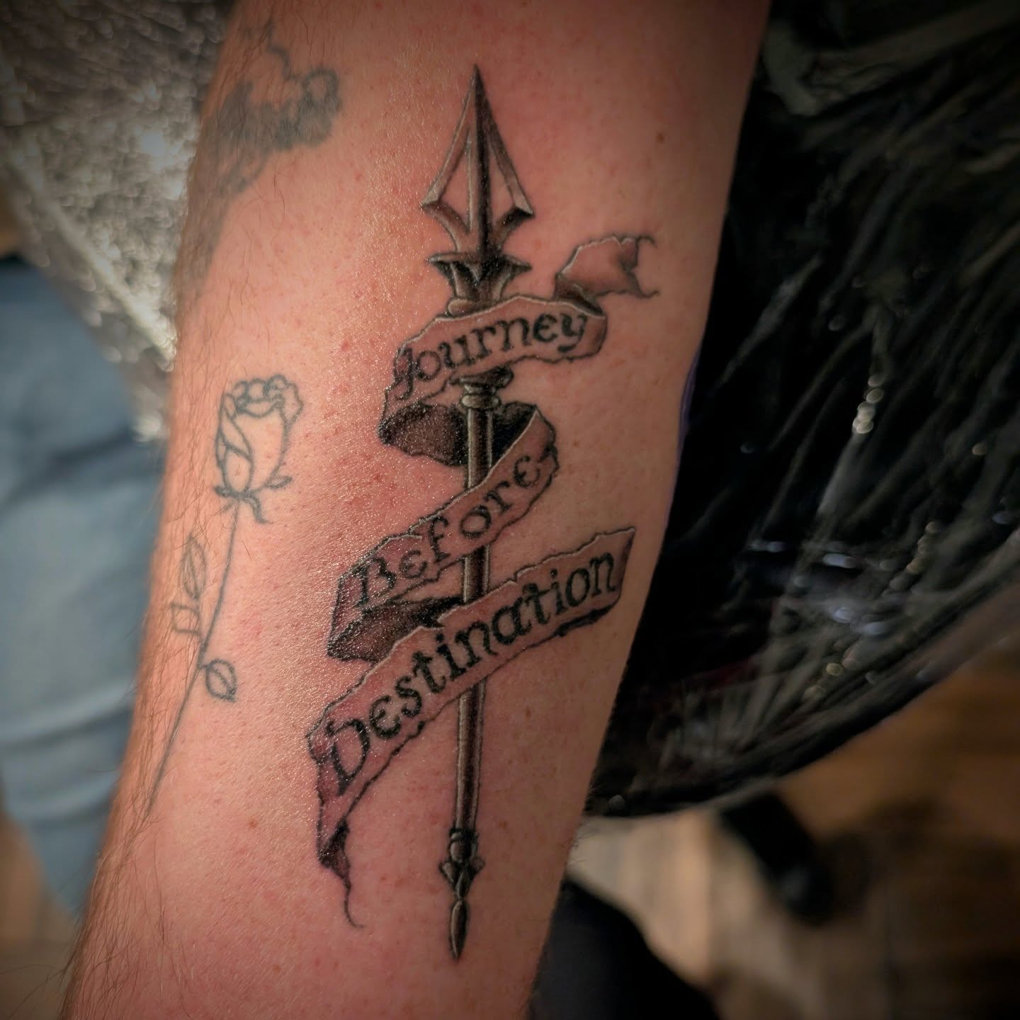 Journey Before Destination black and grey tattoo on the forearm by Rhiannon