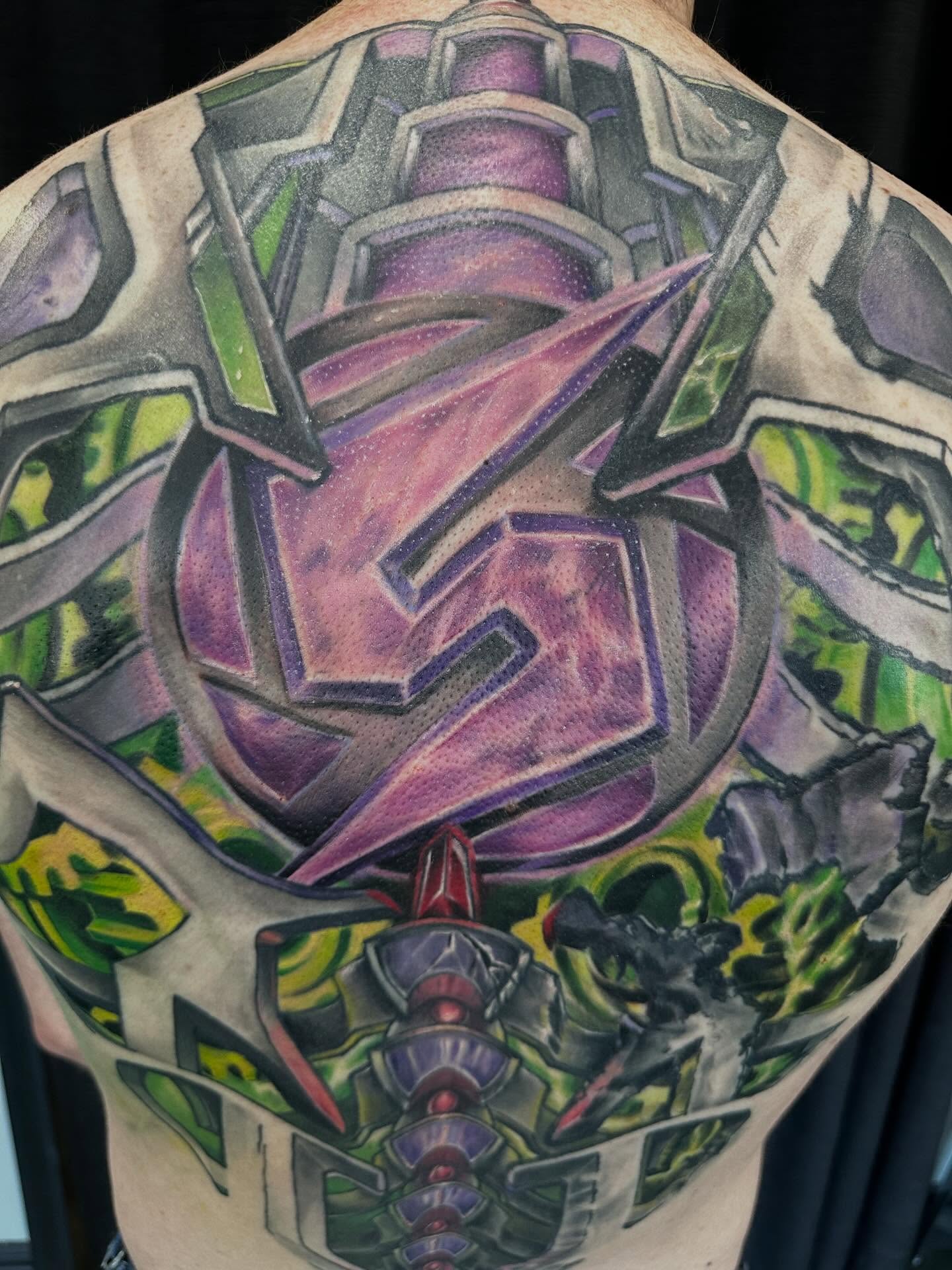 Mecha geometric tattoo on the back by Devon Beyer, Mission, Kansas
