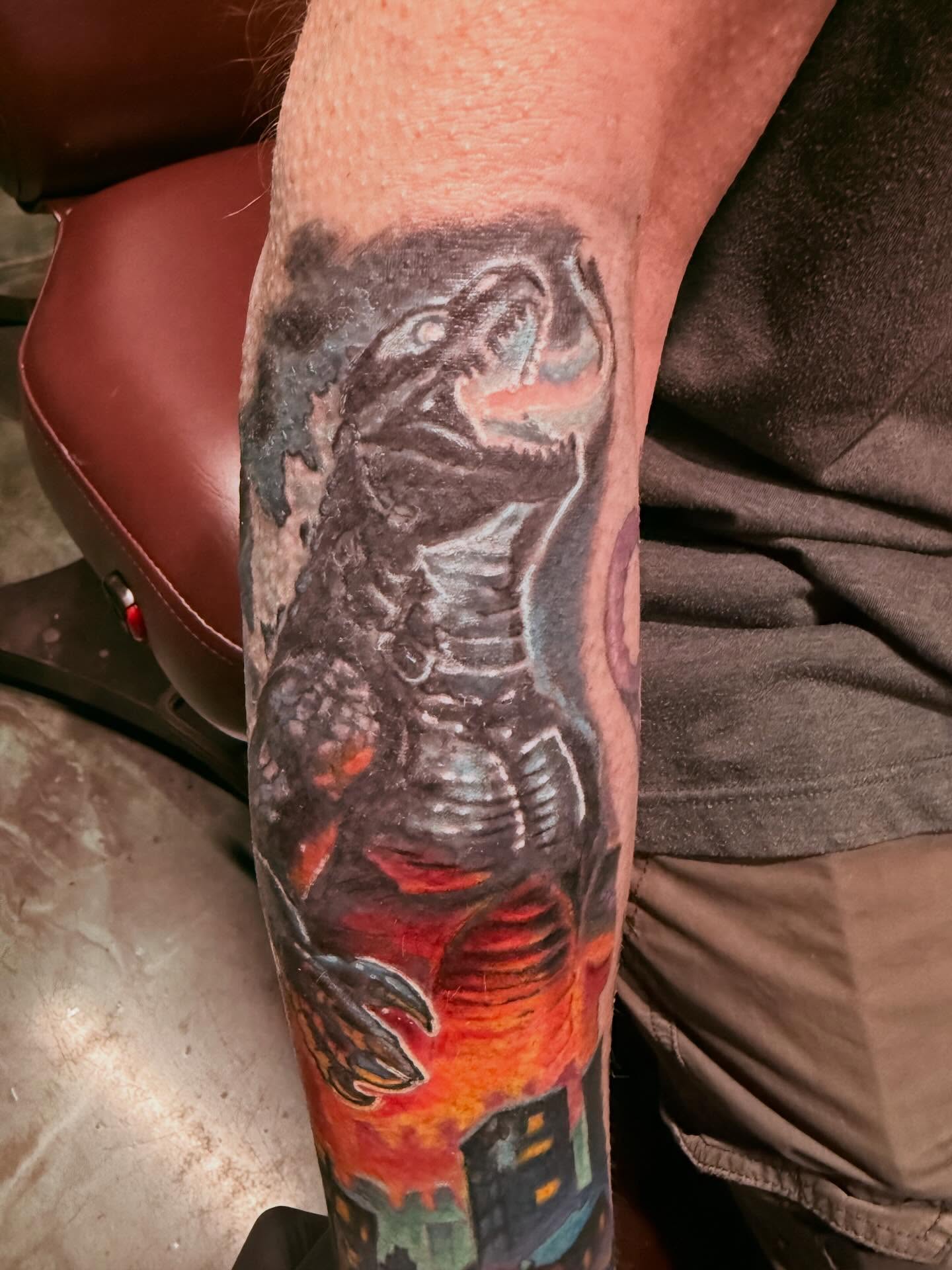 Godzilla realism tattoo on the forearm by Devon Beyer, Mission, Kansas