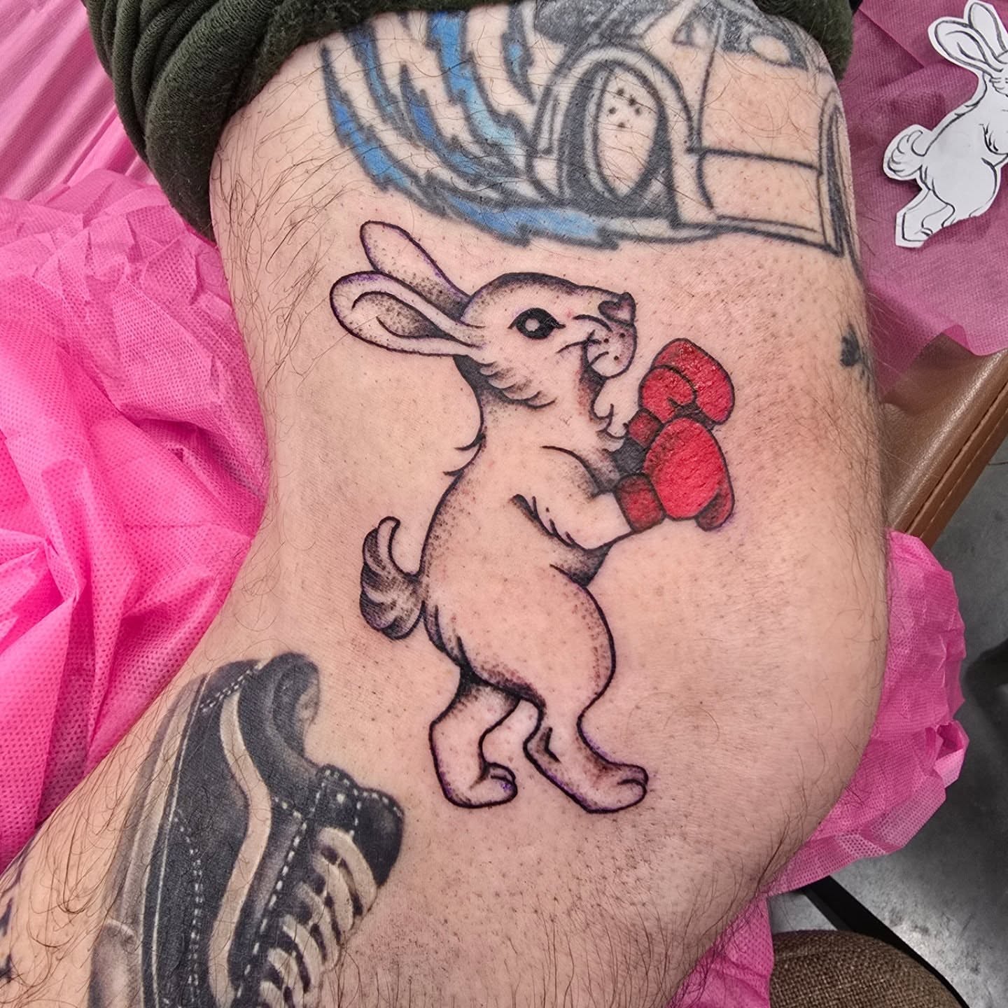 Boxing rabbit realism tattoo on the thigh by Rachel, Centereach, New York