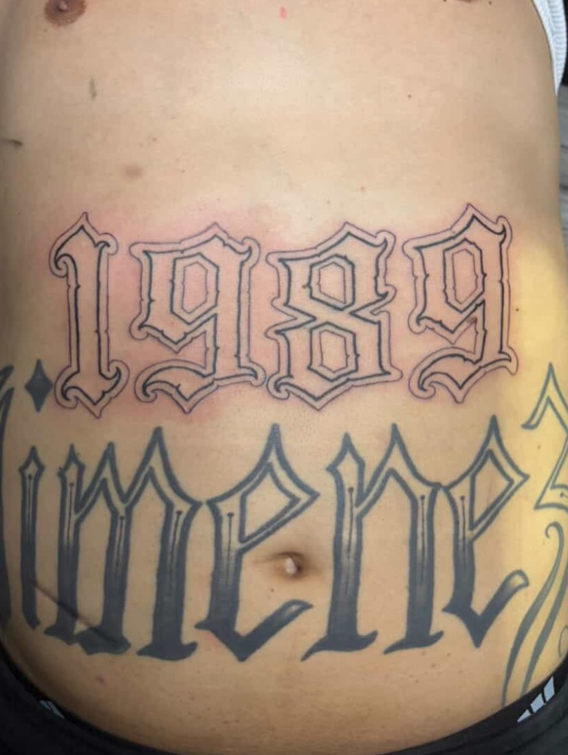 Year and name Chicano tattoo on the torso by Renzoe_piercingz