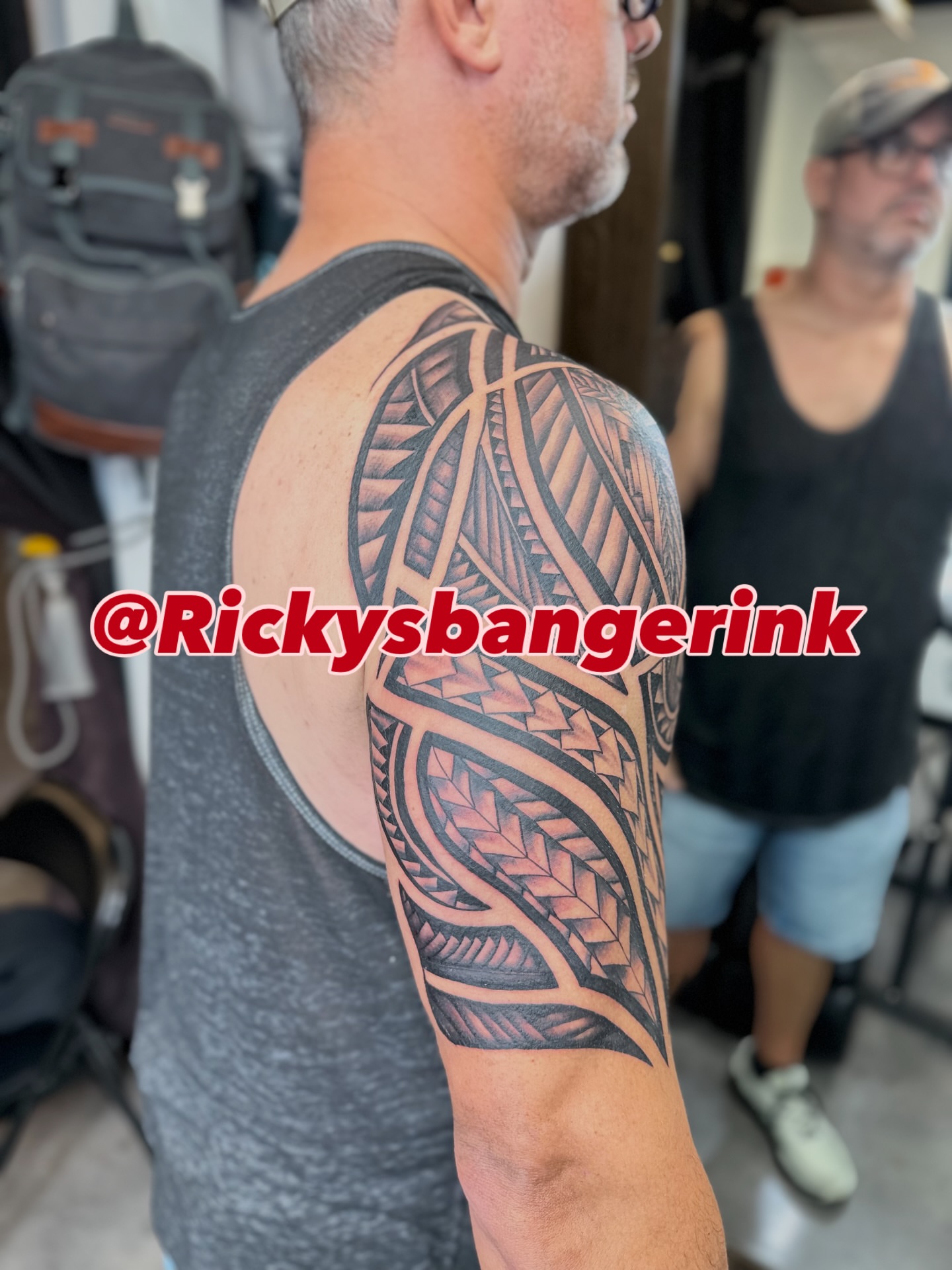 Tribal pattern tribal tattoo on the upper arm by Ricky Flemate, San Antonio