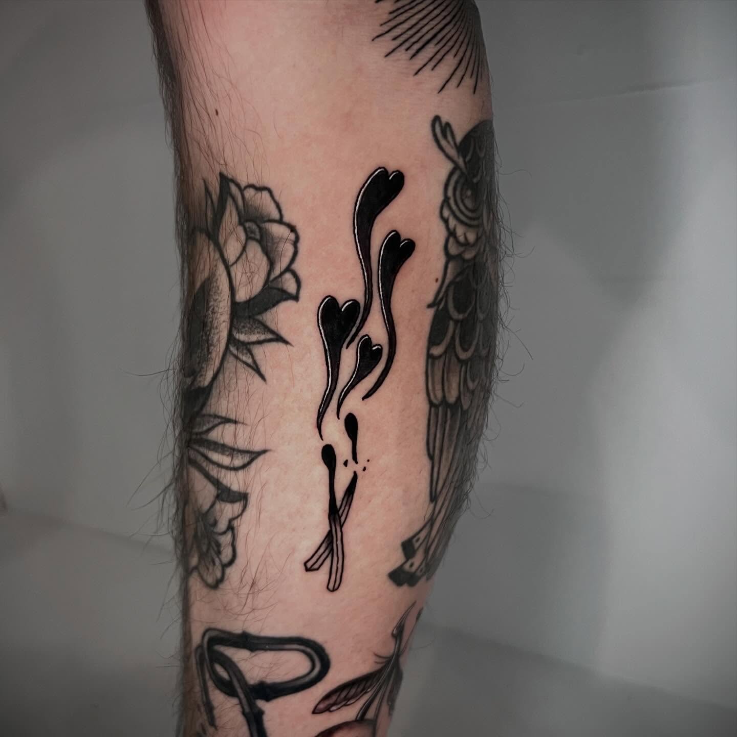 Flower and hearts black and grey tattoo on the forearm by Eoghann McGregor