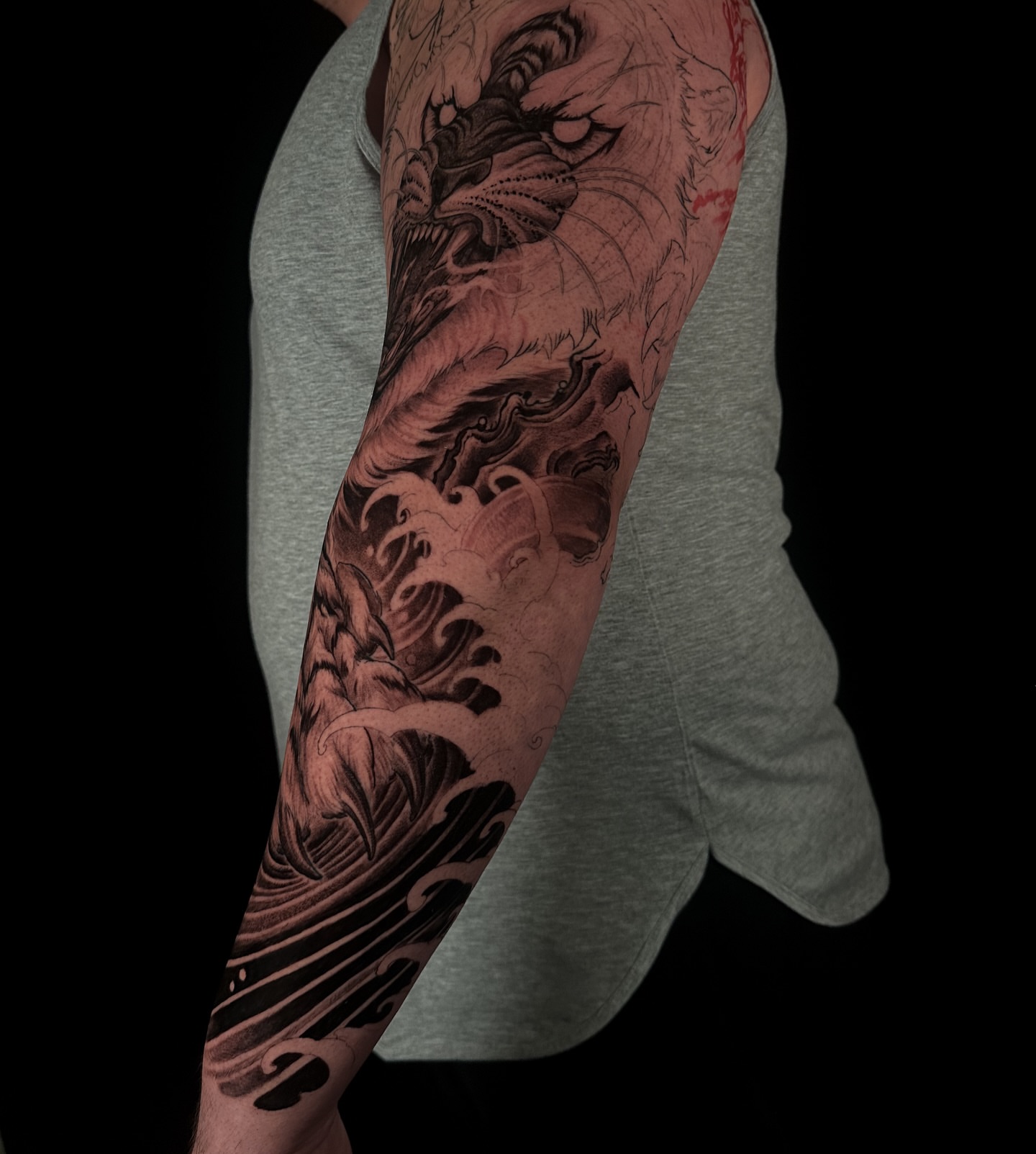 Dragon and waves japanese irezumi tattoo on the forearm by Vince Lau