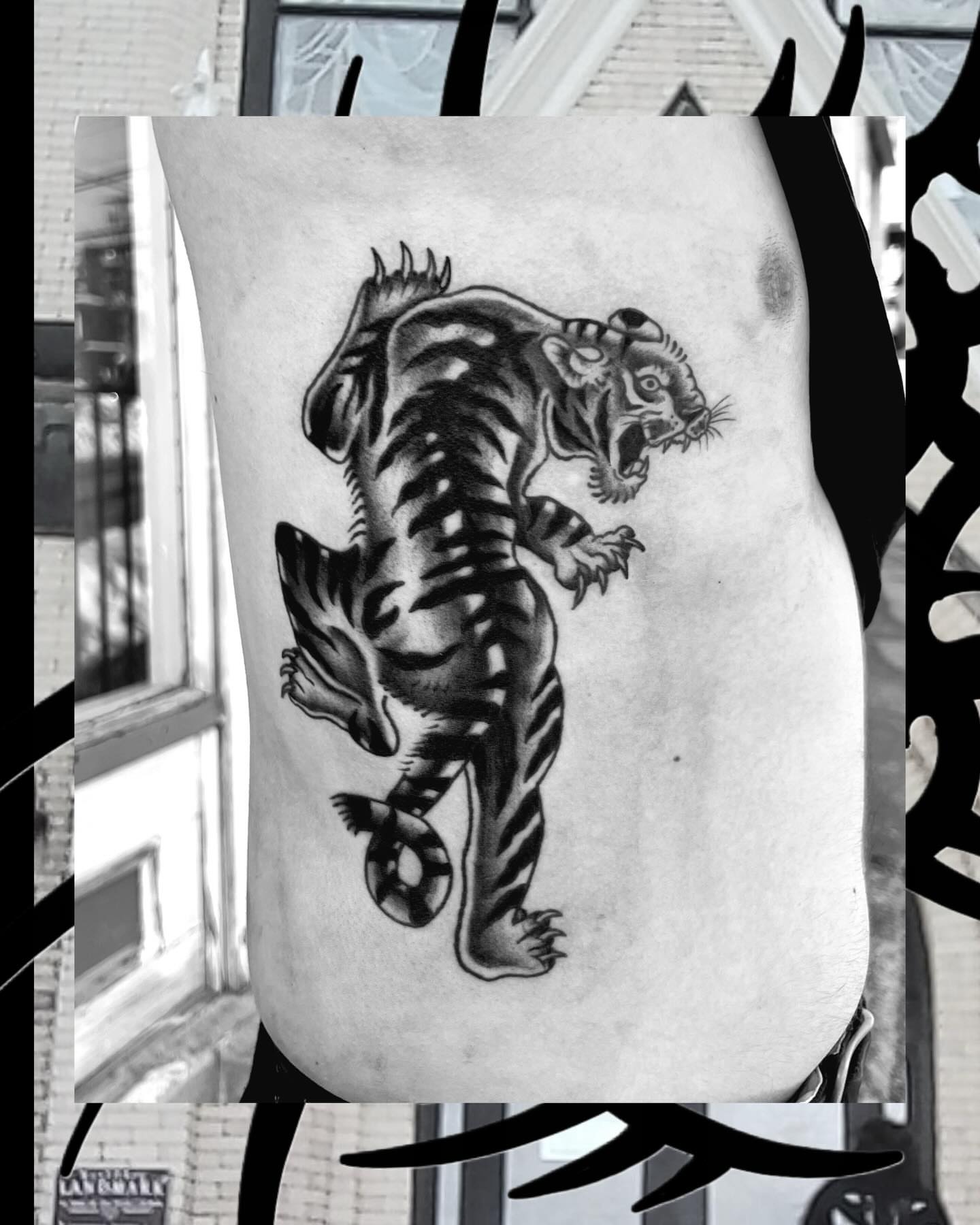 Tiger black and grey tattoo on the ribs by Ady Paige