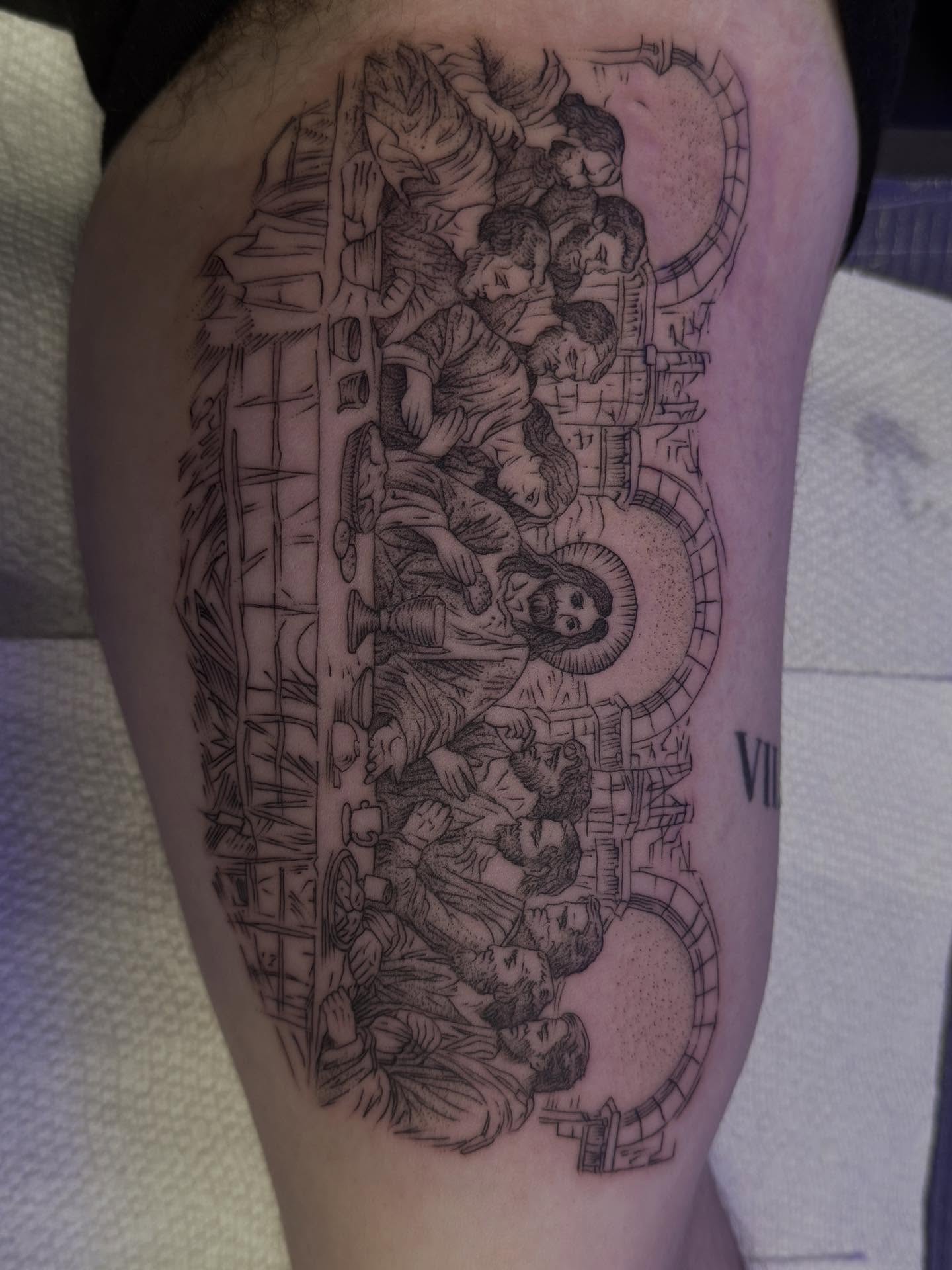 The last supper realism tattoo on the thigh by Ashley matthews