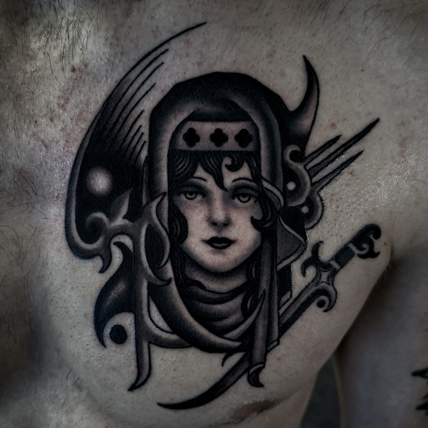 Woman with crown American traditional tattoo on the chest by Brandon Murphy