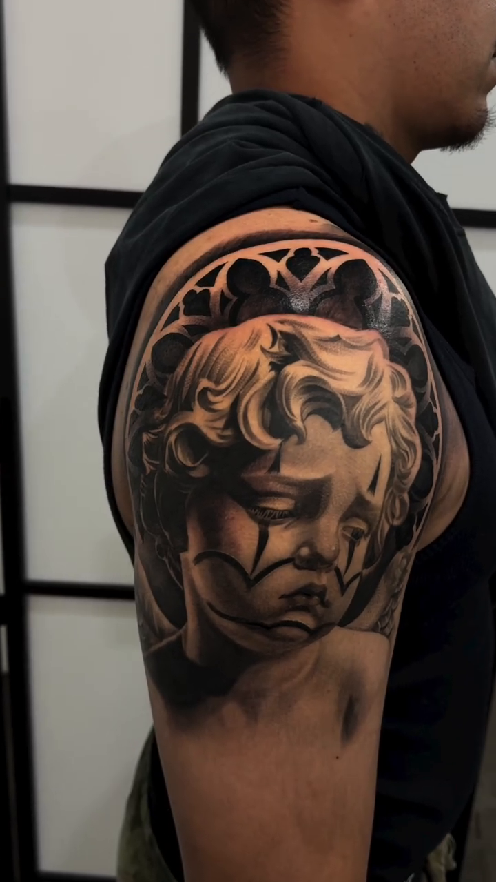 Sad clown face realism tattoo by Isaac Barrientos