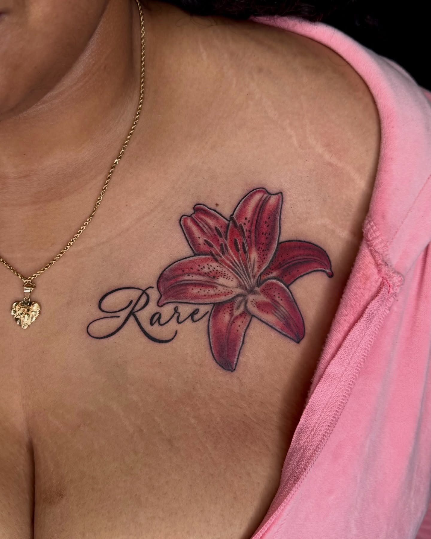 Lily realism tattoo on the chest by Too Zen