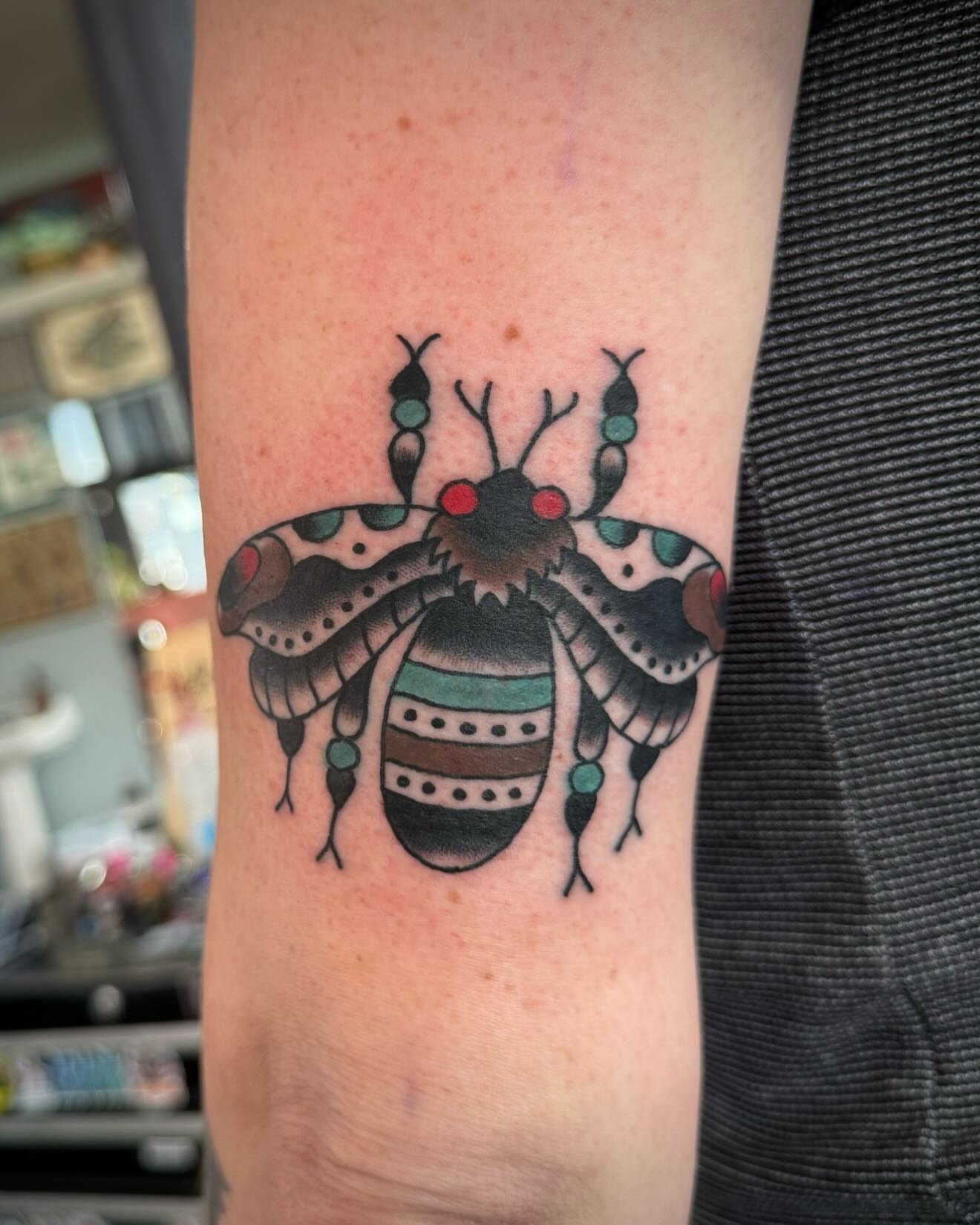 Bee American traditional tattoo on the forearm by kalli berry