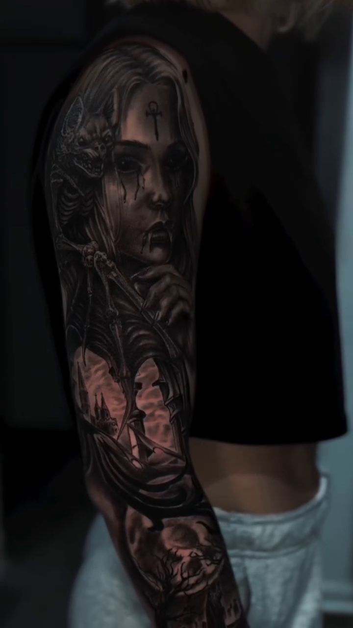 Woman and skulls dark realism tattoo by Miguel Garcia