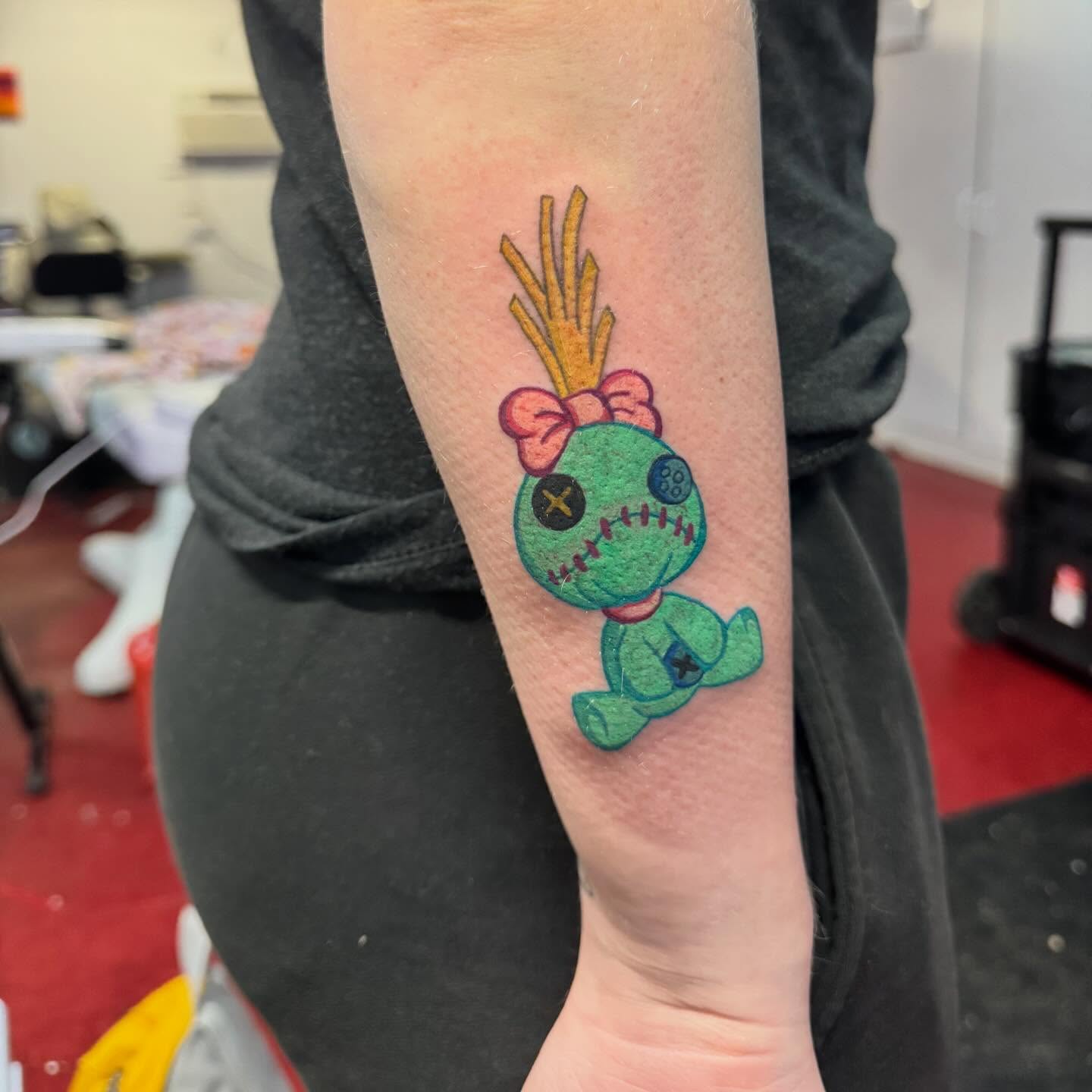 Voodoo doll American traditional tattoo on the forearm by 🪬🍄Larissa Potter🍄🪬