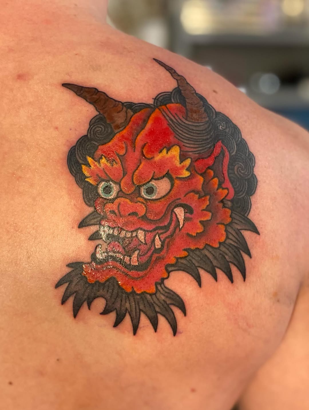 Oni mask Japanese tattoo on the shoulder by jim collins, Dayton, Ohio