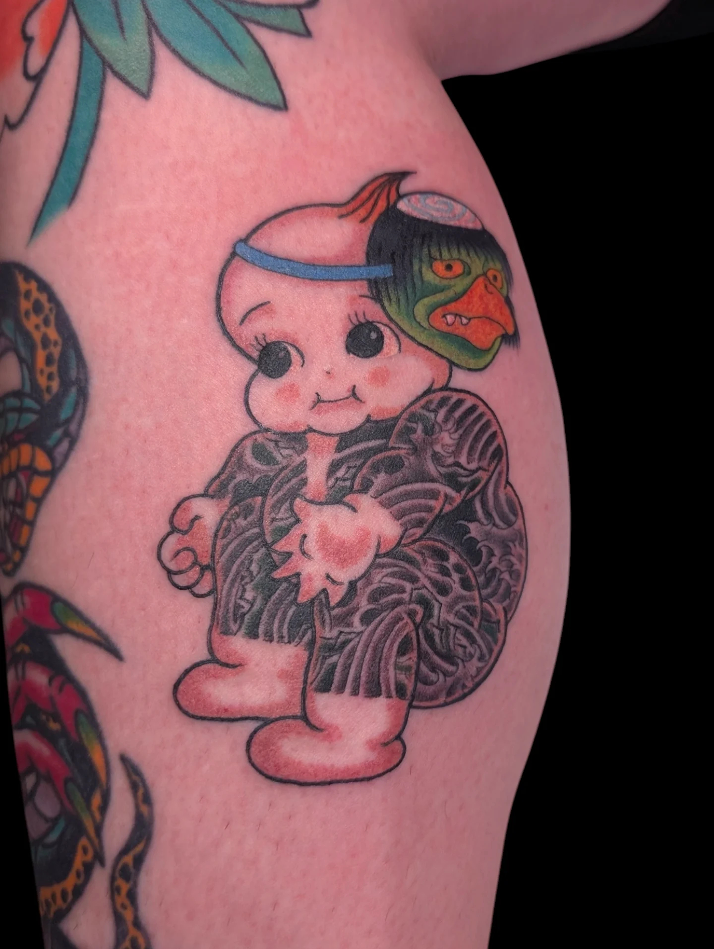 Kappa American traditional tattoo on the thigh by Angela Mukai