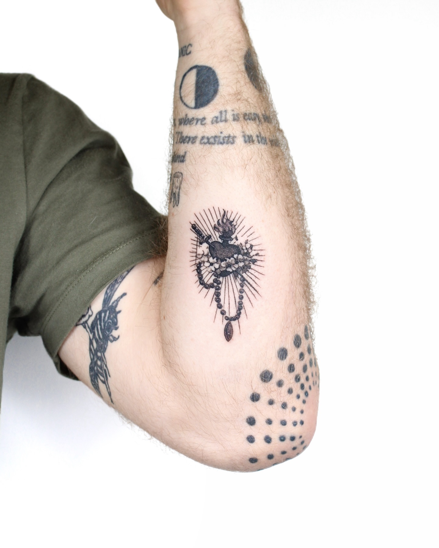 Religious icon dotwork tattoo on the forearm by Tatmostat