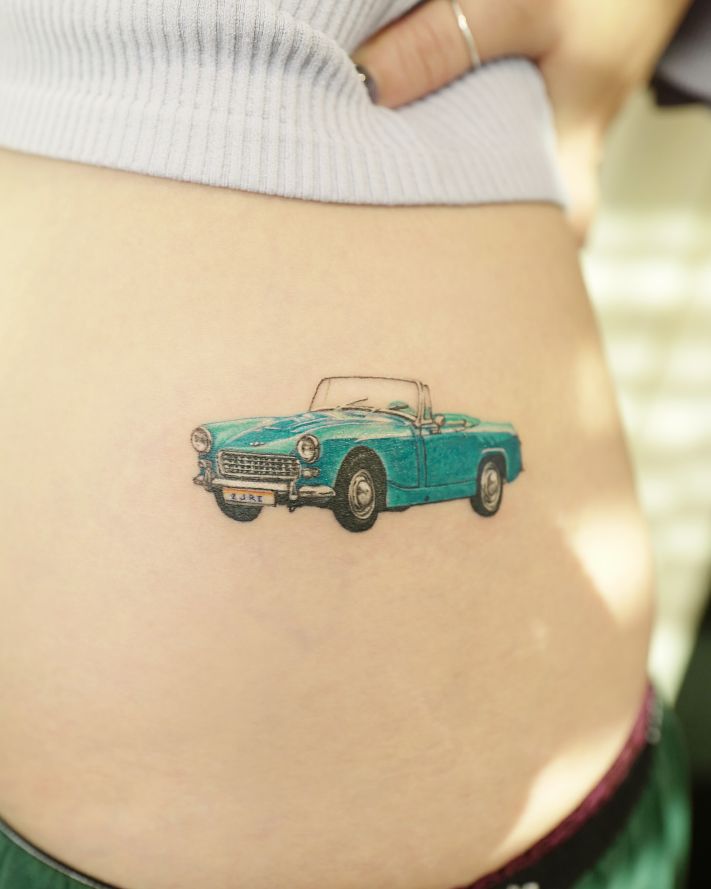 Car realism tattoo on the torso by YUN