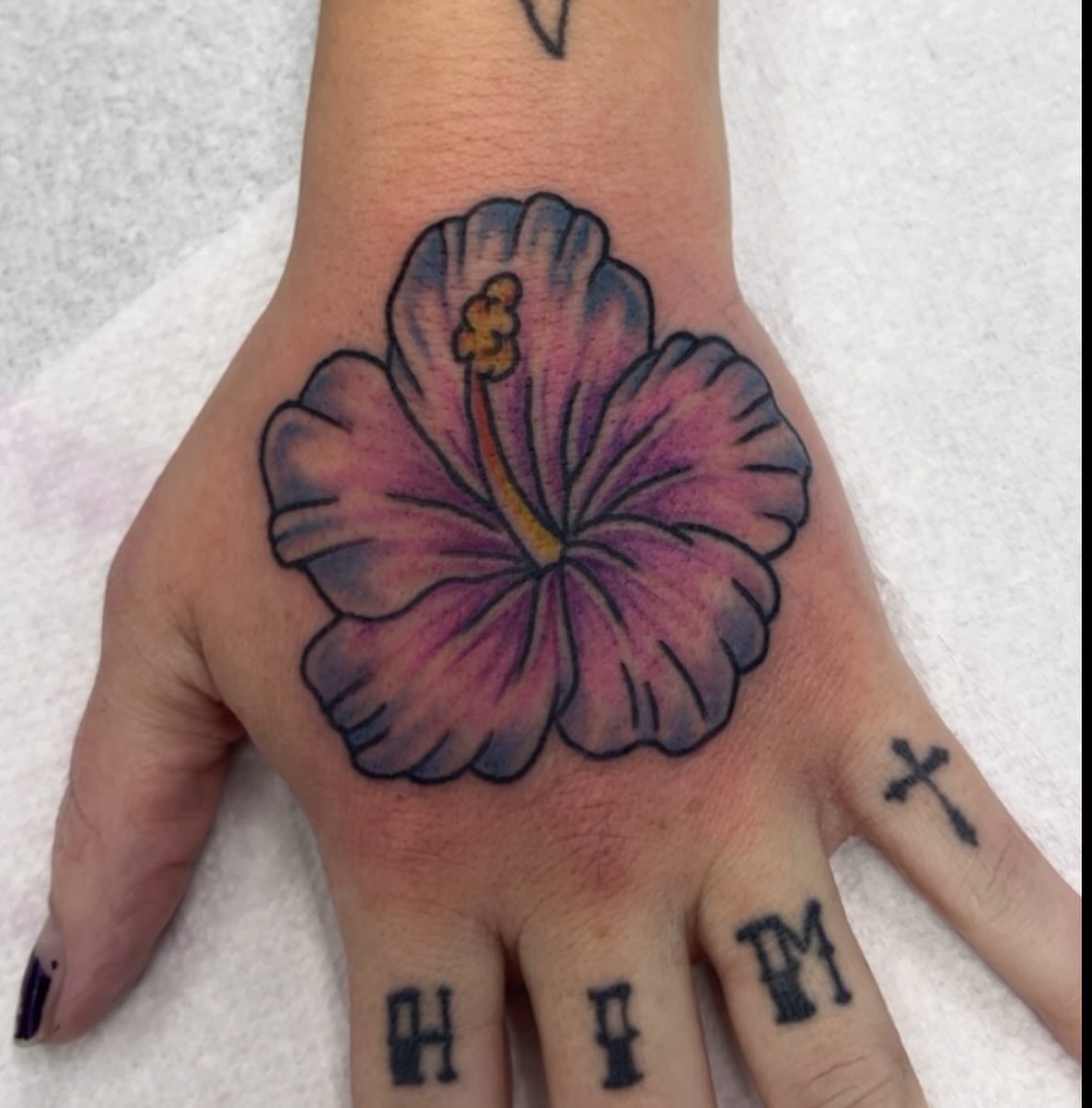 Hibiscus flower realism tattoo on the hand by Franky Sharpz