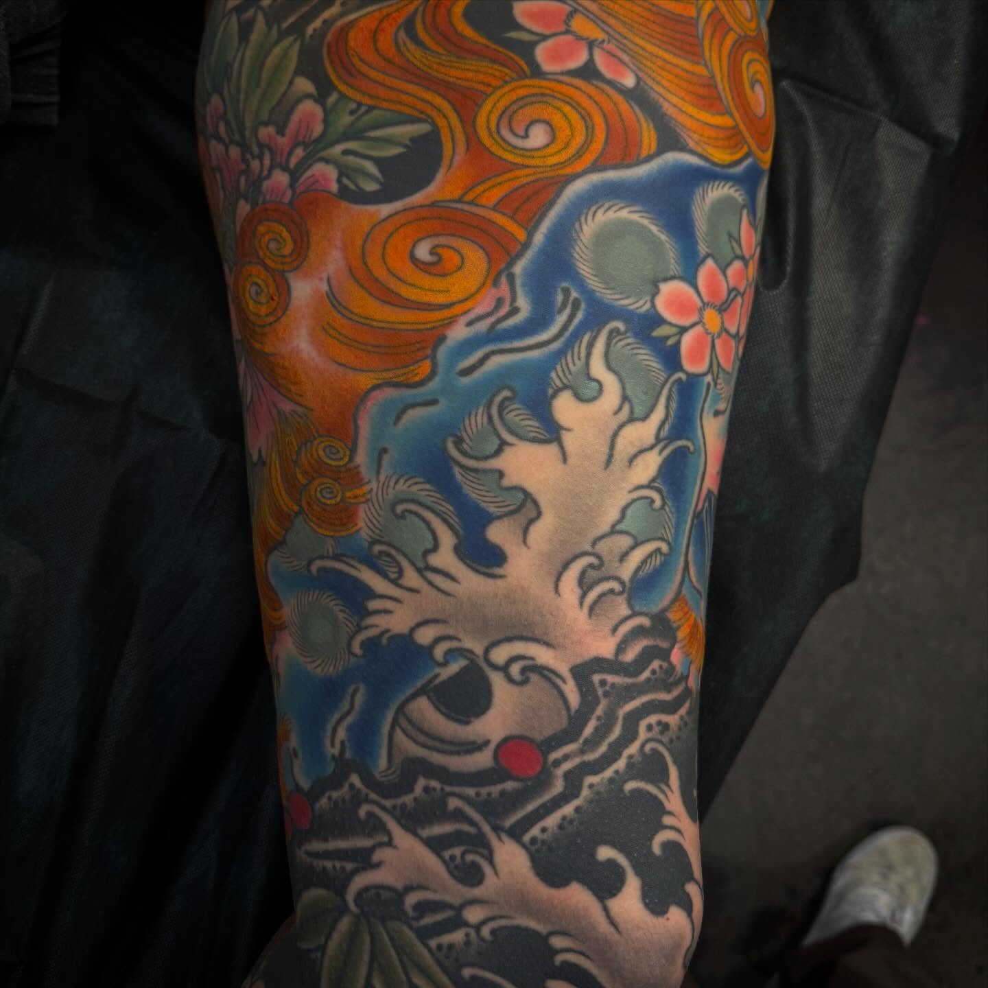 Dragon and waves japanese irezumi tattoo on the forearm by Mike Diamond