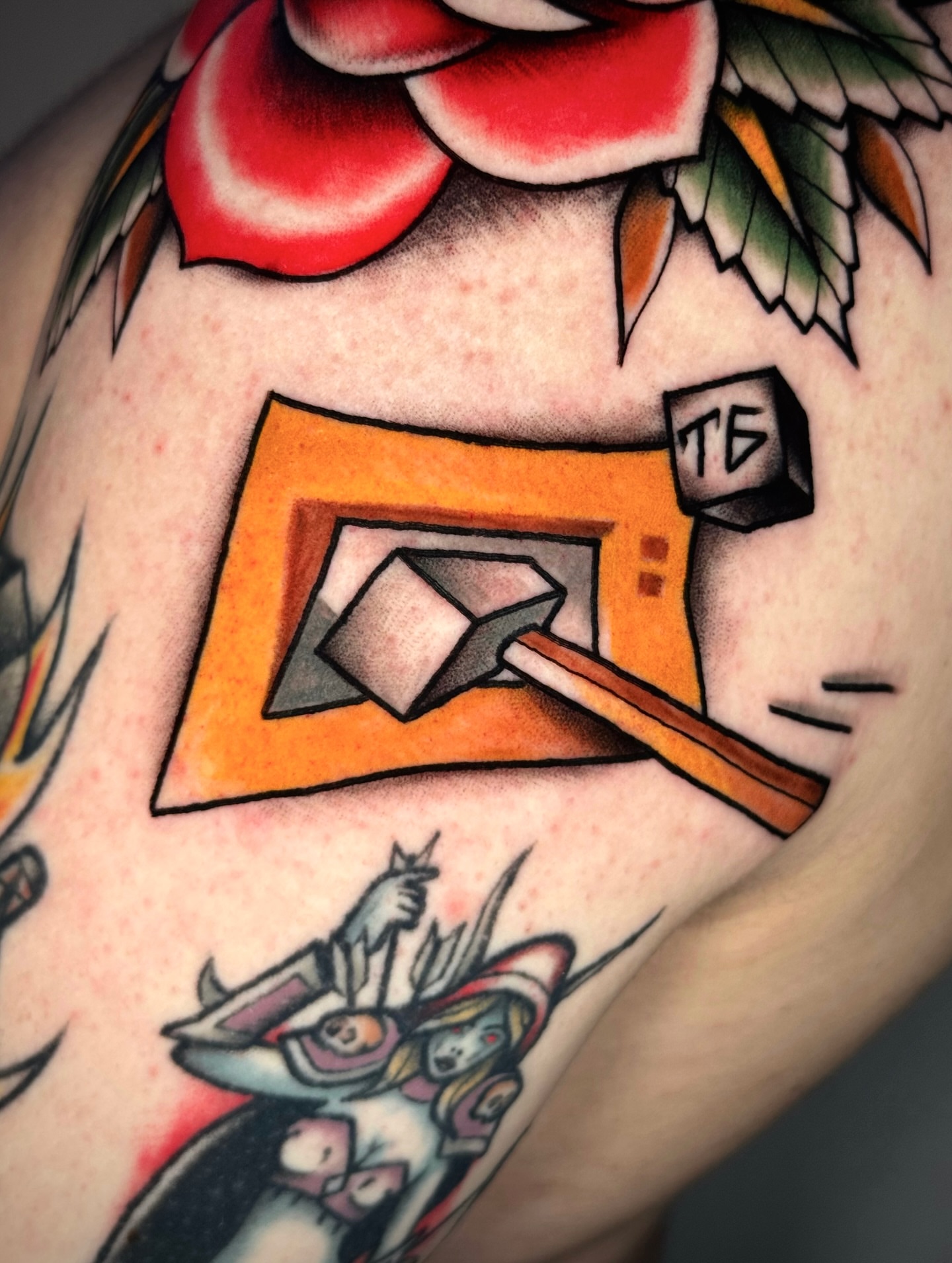 Hammer and cube American traditional tattoo on the shoulder by Black and color tattoo!