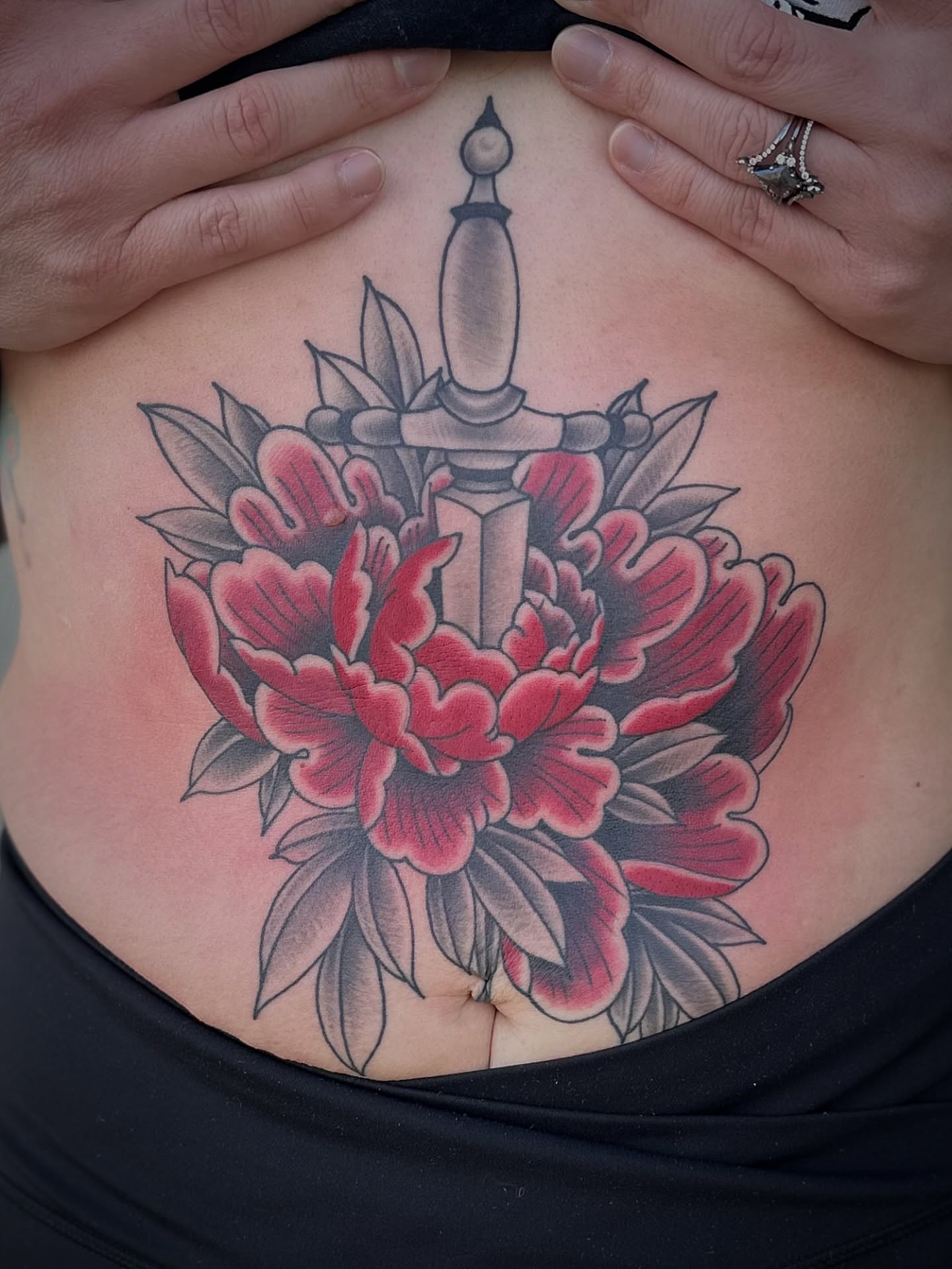 Peony and dagger American traditional tattoo on the torso by Walk-in American Traditional Tattoos Las