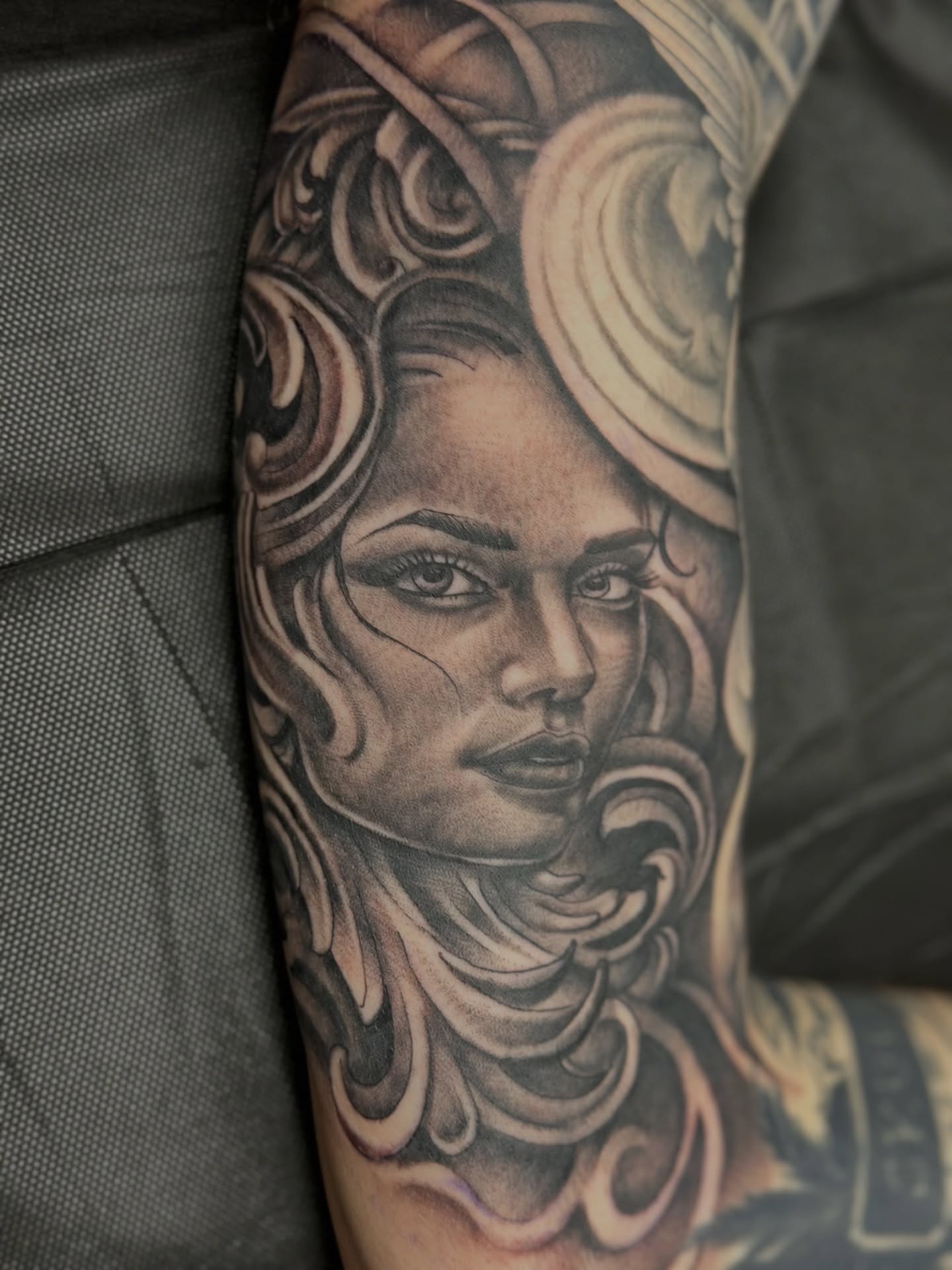 Woman's face realism tattoo on the forearm by Stevie O'Dell