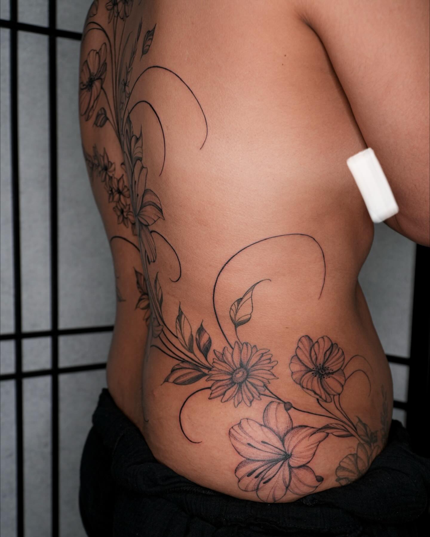 Floral design black and grey tattoo on the ribs by Pandora ✨ Floral, Los Angeles, California