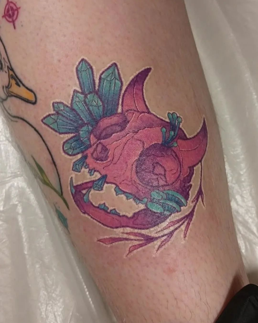 Skull with crystals new school tattoo on the forearm by Kim