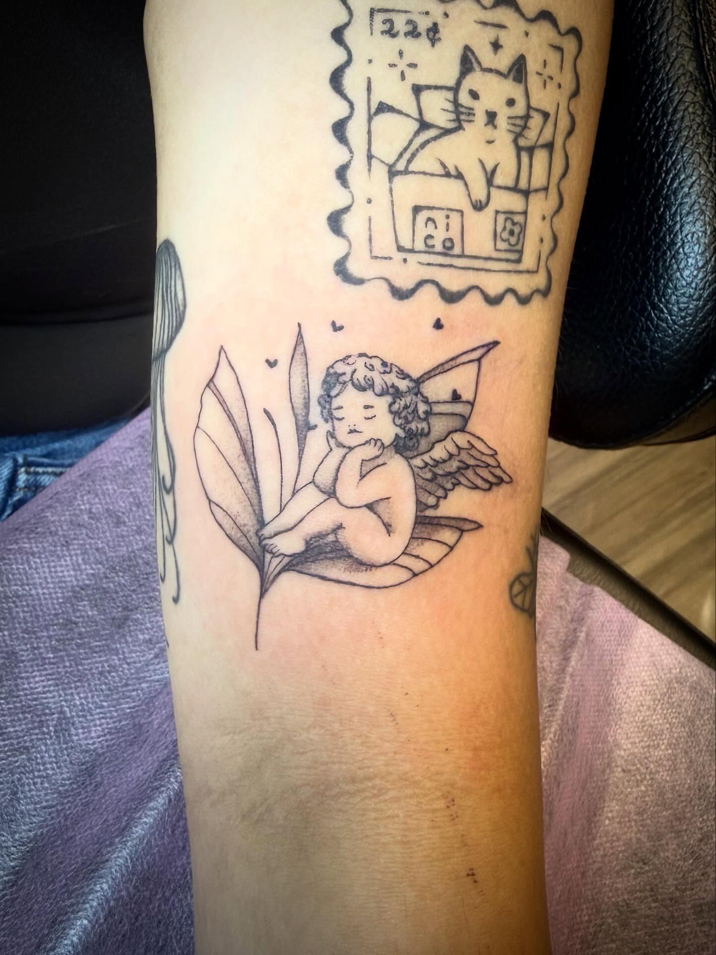 Angel on leaf black and grey tattoo on the forearm by Taytum Marsing, Salt Lake City, Utah