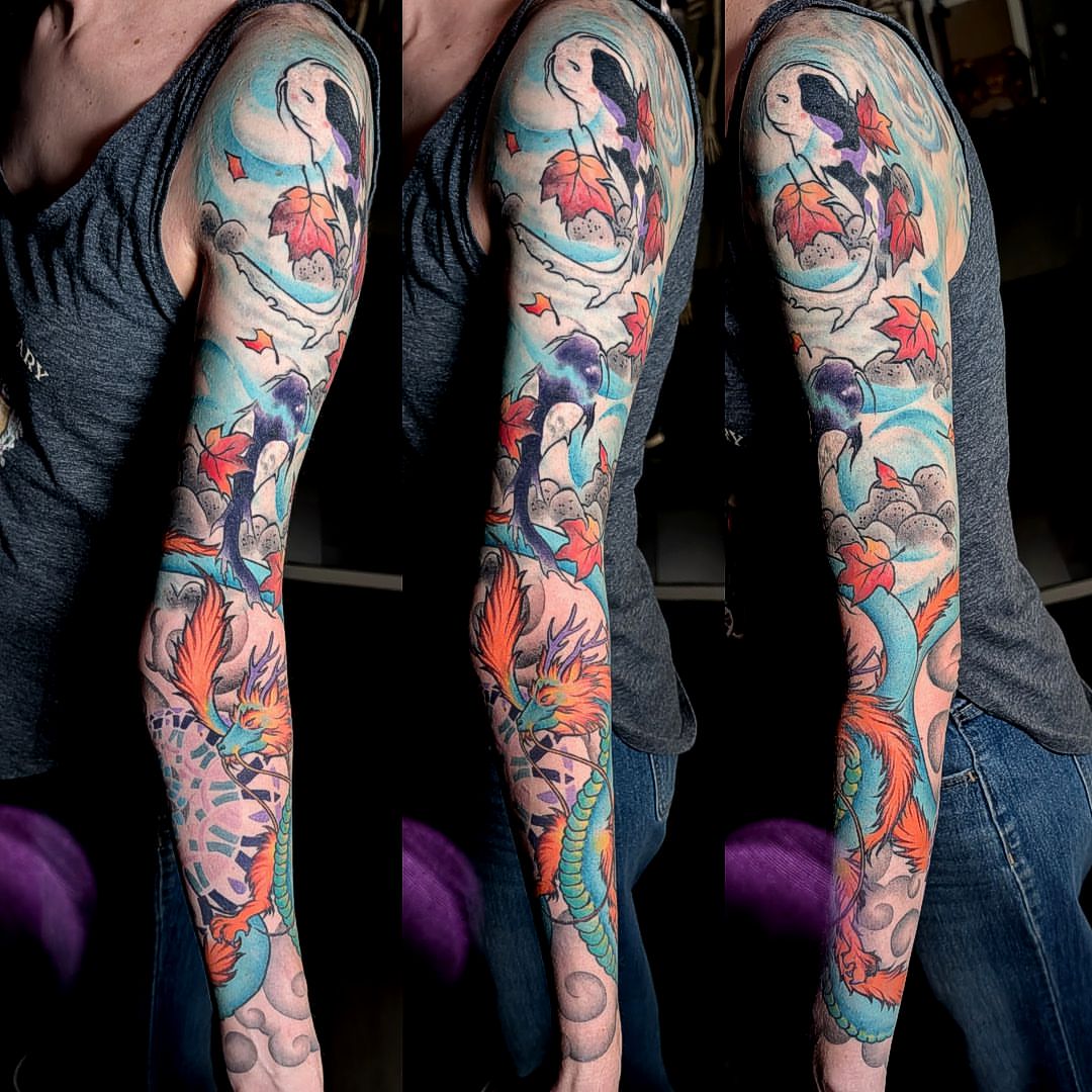 Koi fish and dragon japanese irezumi tattoo on the upper arm by Dave Chercourt, Willoughby, Ohio