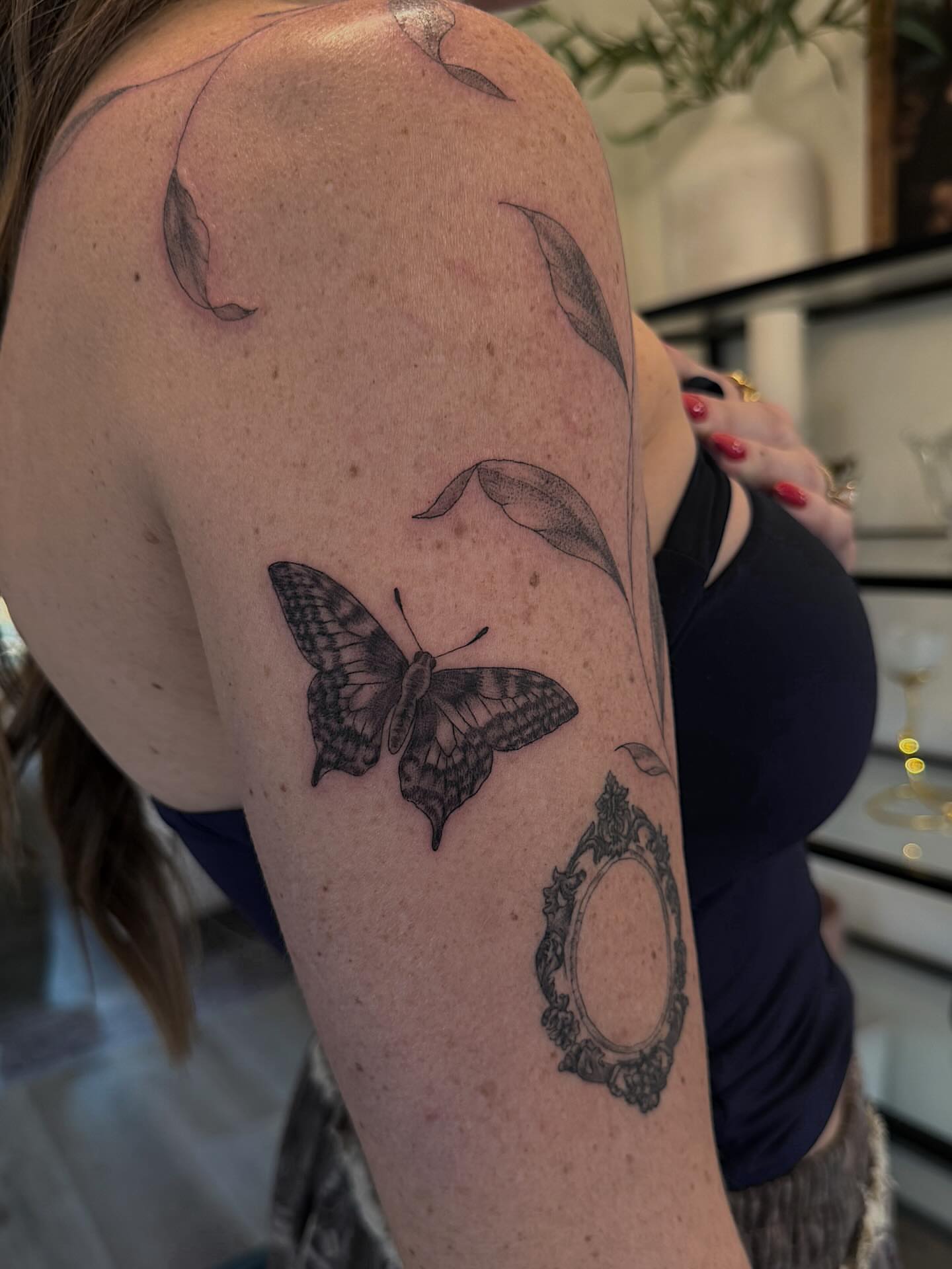 Butterfly black and grey tattoo on the upper arm by Shelby Lynn Bayles, Ogden, Utah