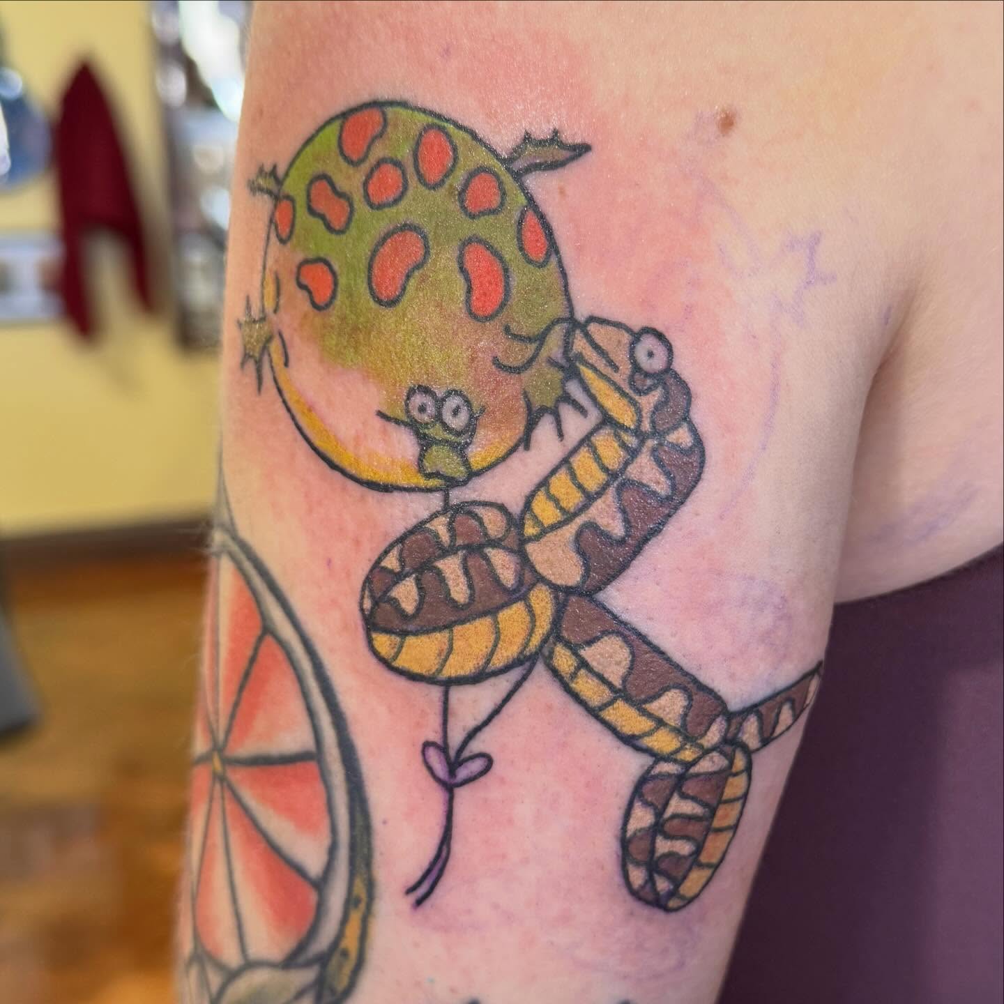Snake and fruit dotwork tattoo on the forearm by Erin McDavis