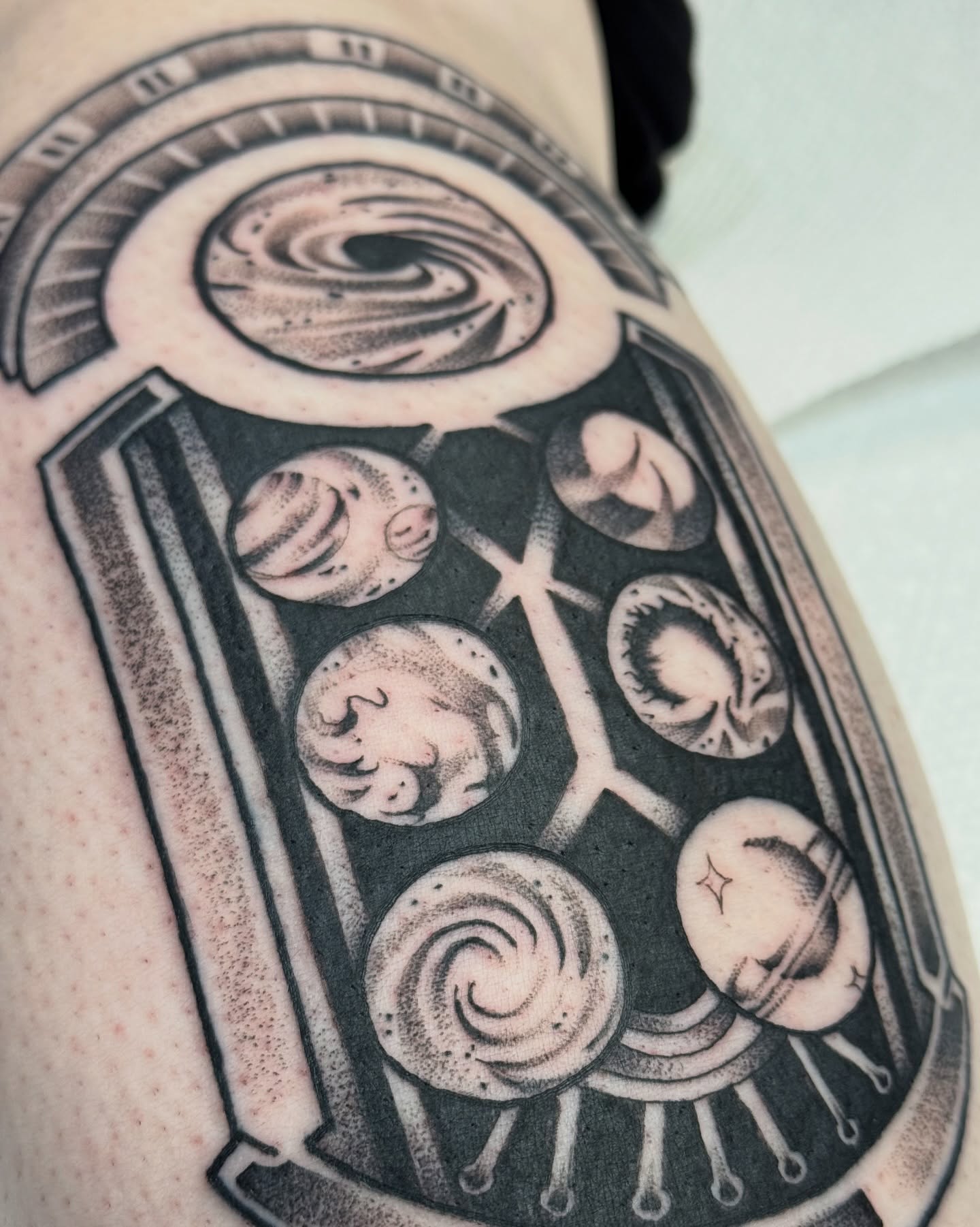 Space-themed dotwork tattoo on the shoulder by Mish