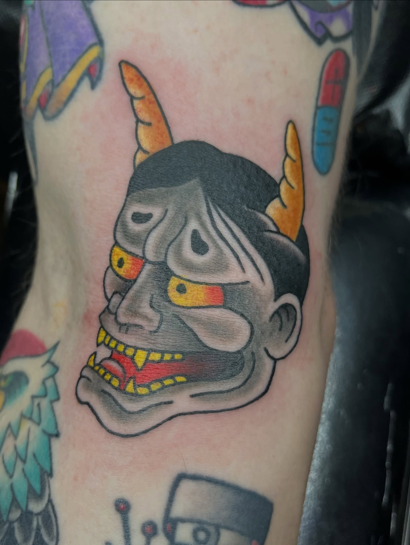Demon mask American traditional tattoo on the forearm by Brian Easlon