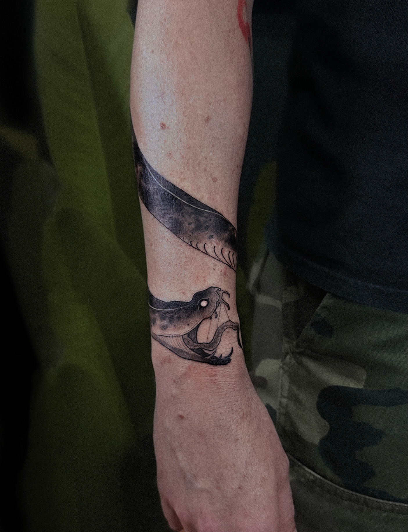 Snake black and grey tattoo on the forearm by Tattoo Artist 👩🏻‍🎨 ATX