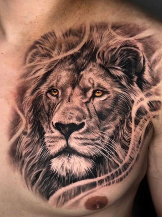 Lion portrait realism tattoo on the chest by Peter John