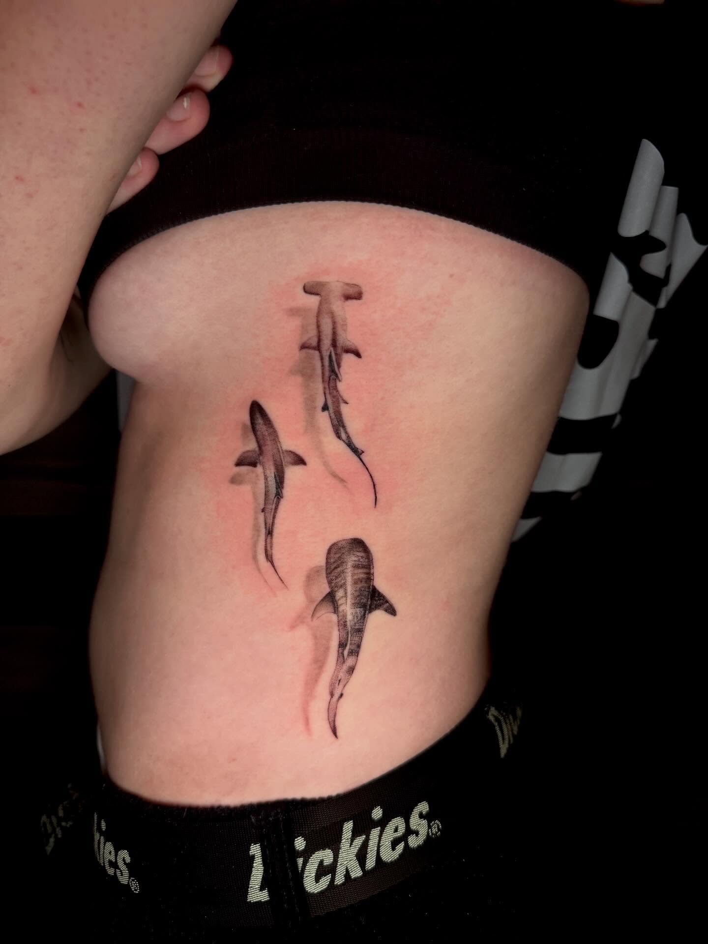 Sharks realism tattoo on the ribs by Gabrielle Mack