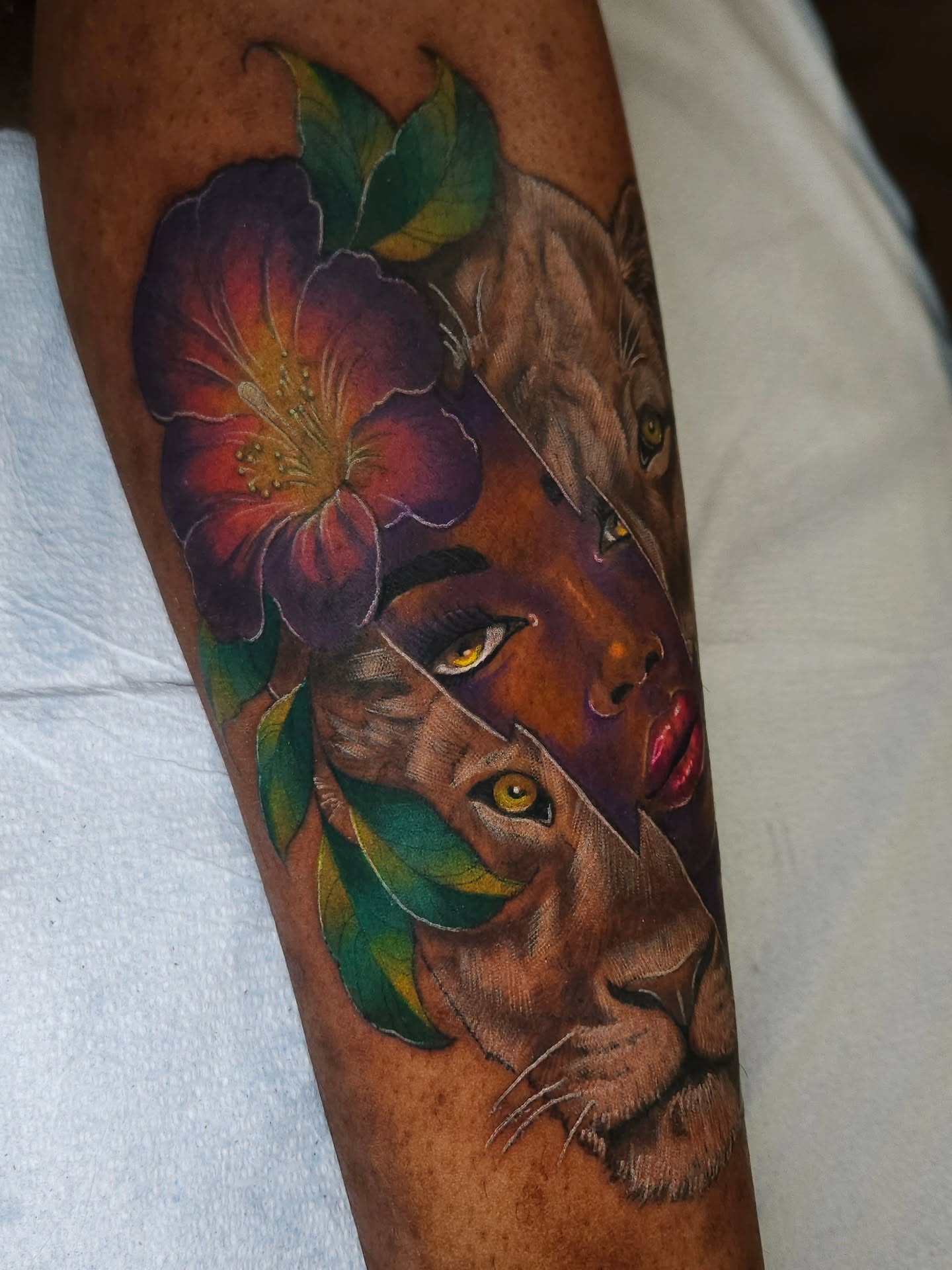 Lioness and flower realism tattoo on the forearm by ๐๐๐๐