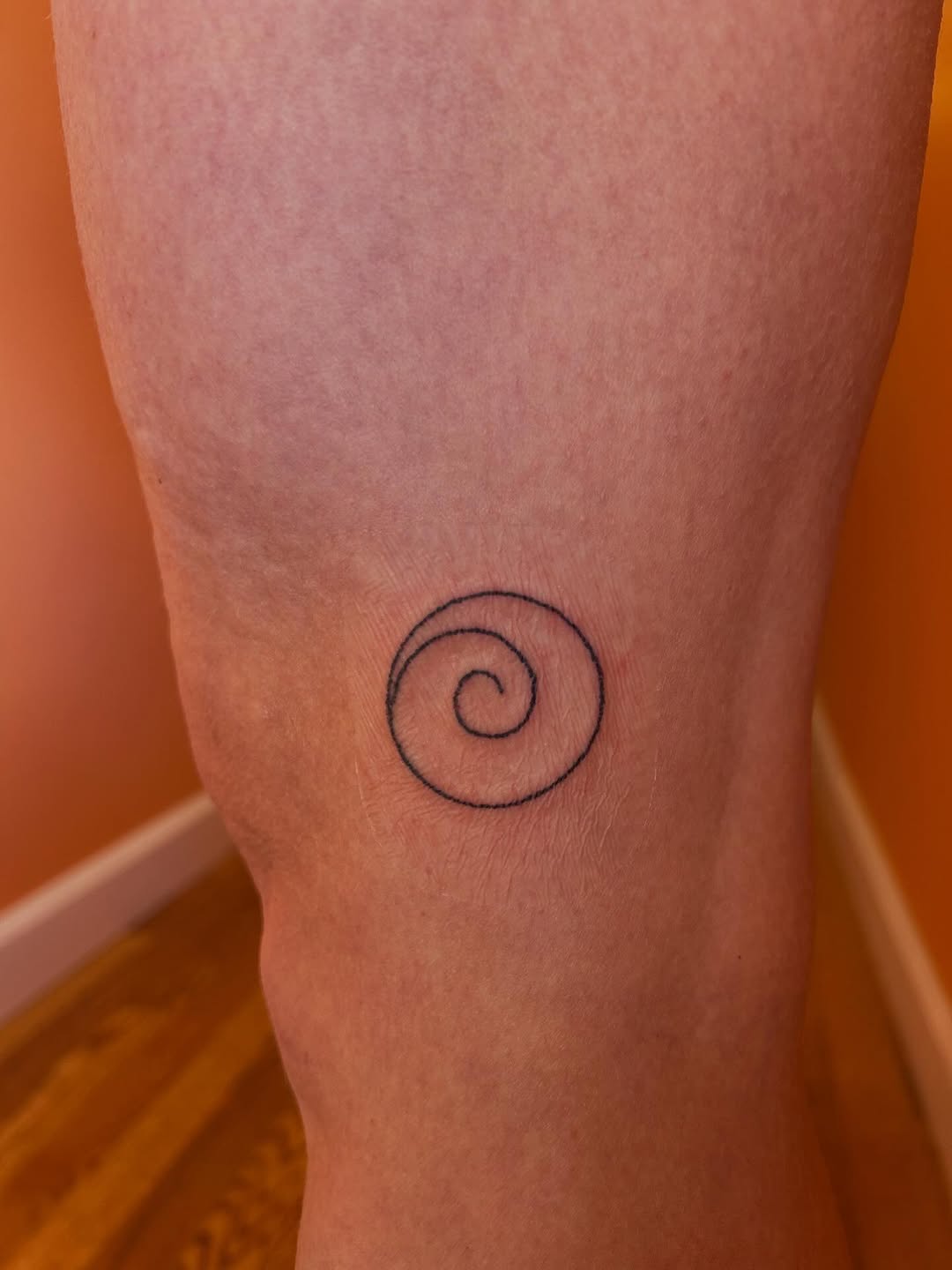 Spiral tribal tattoo on the calf by Emma D