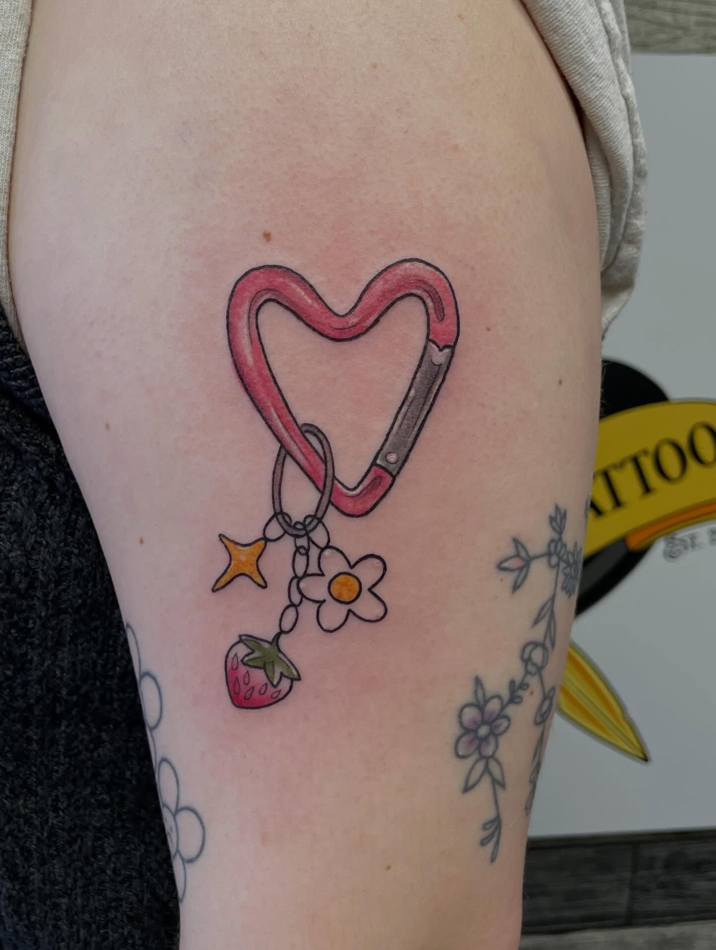 Heart-shaped carabiner new school tattoo on the thigh by Stevie Timmreck, Utica, Michigan