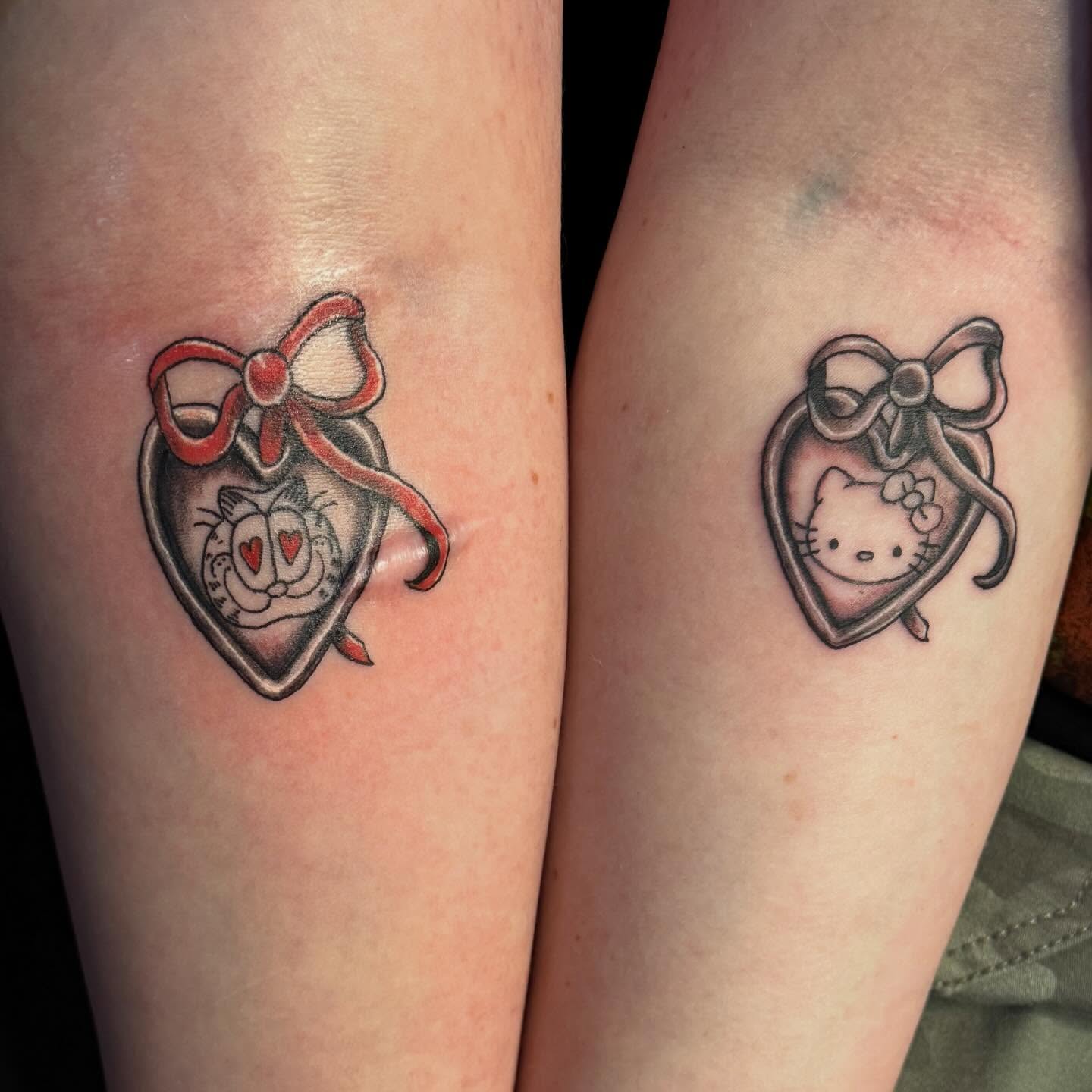 Cat and hello kitty black and grey tattoo on the forearm by 🌛 𐌀𐌋𐌄𐋄𐌉𐌔 🌜