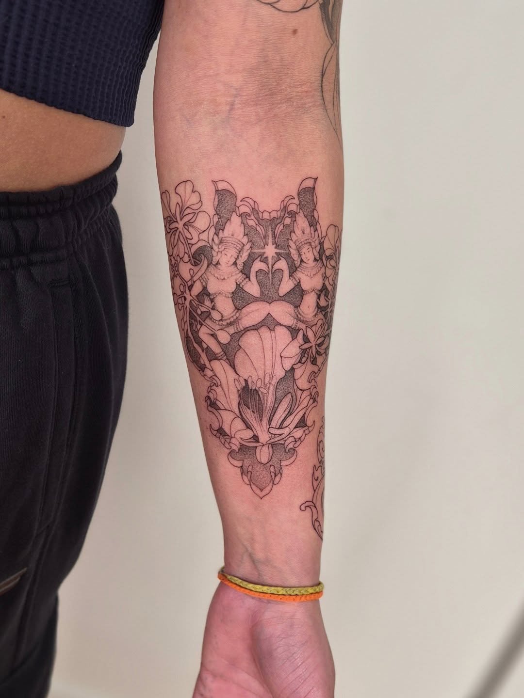 Deity figures black and grey tattoo on the forearm by Sophorn Long (soapy)