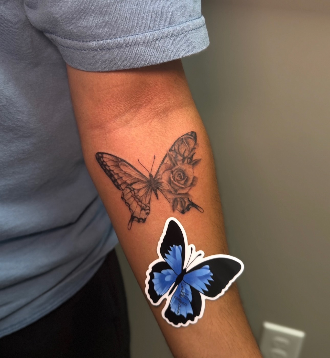 Butterfly and rose black and grey tattoo on the forearm by Hannah Marie ๐ฆ, Benbrook, Texas