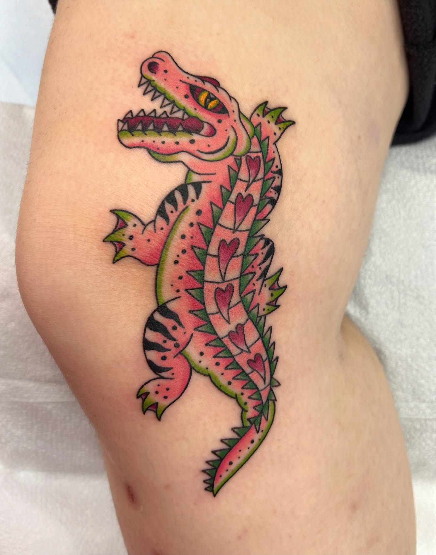 Alligator American traditional tattoo on the thigh by Courtney