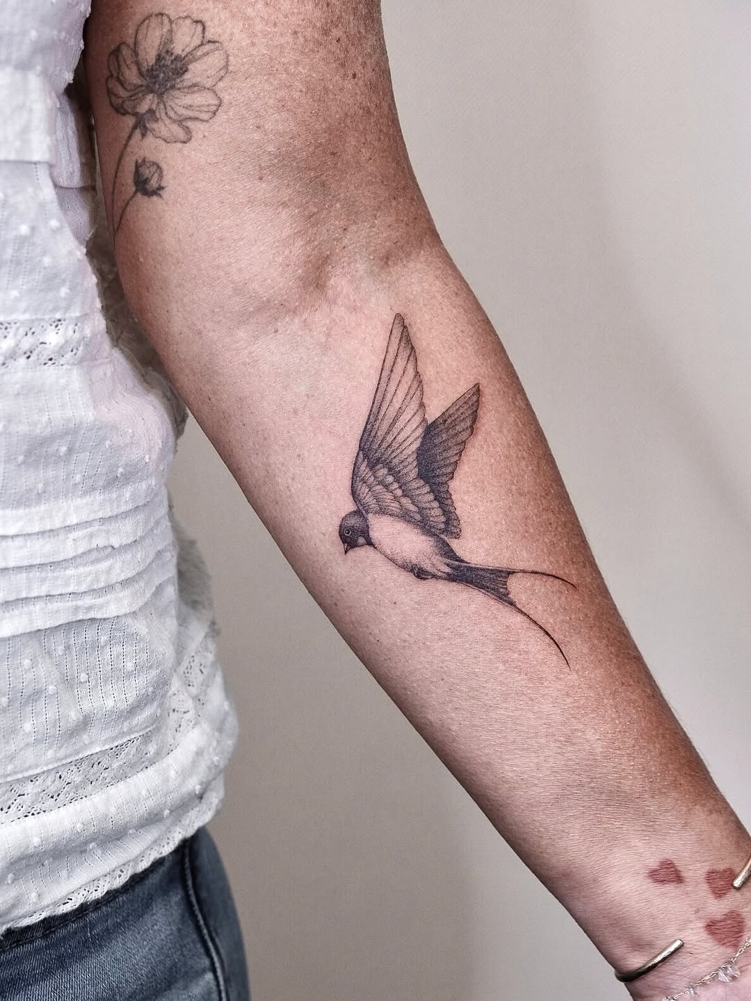 Swallow bird fine line tattoo on the forearm by Your tattoo Artist, New York, New York