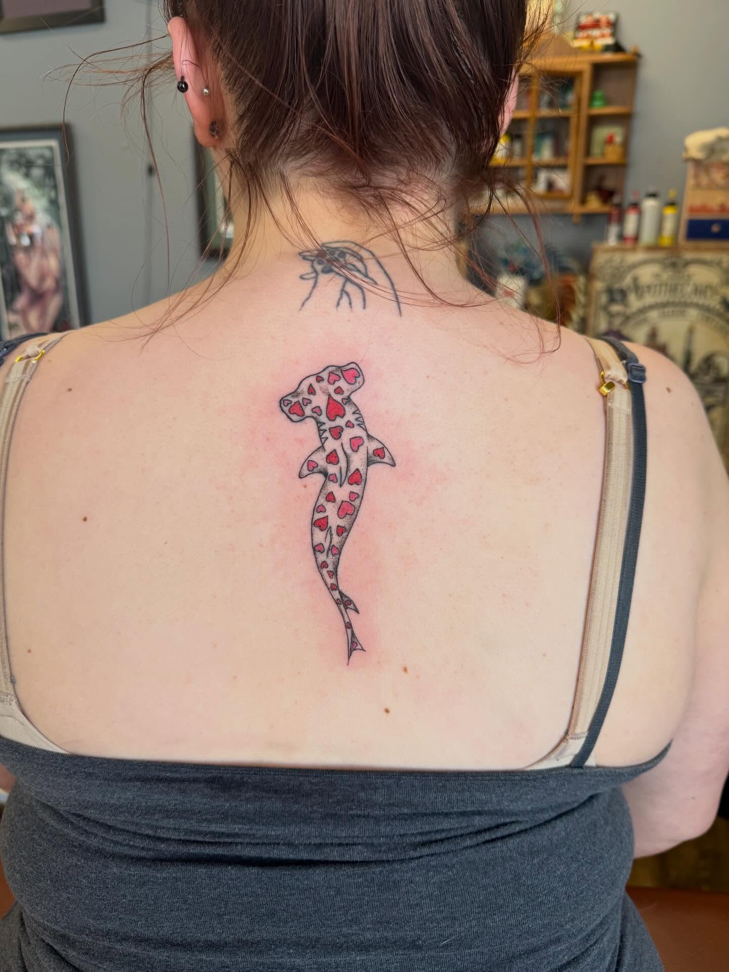 Shark with hearts trash polka tattoo on the back by Hope Powell, Vancouver, Washington