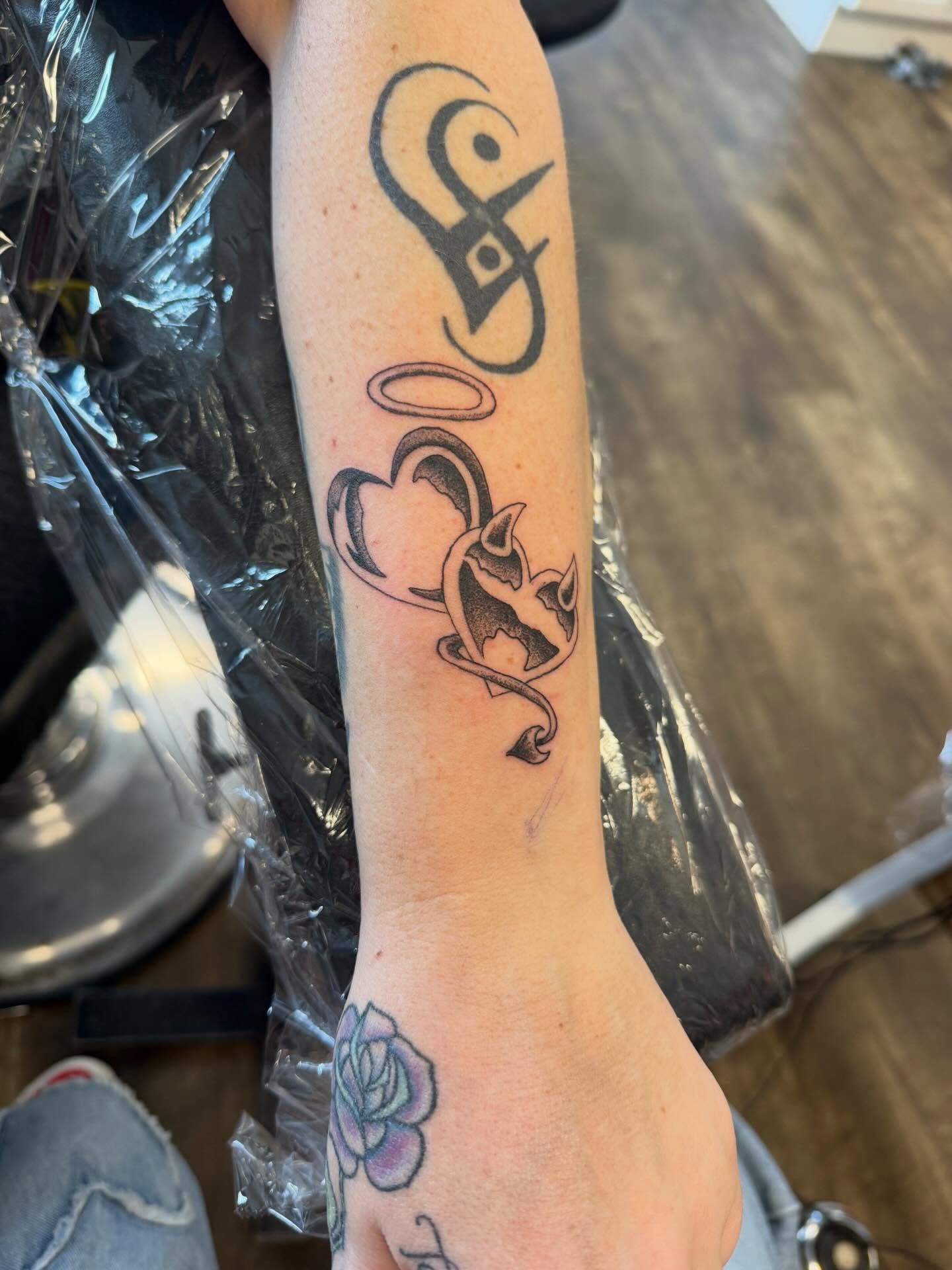Heart with wings black and grey tattoo on the forearm by Hope Powell, Vancouver, Washington