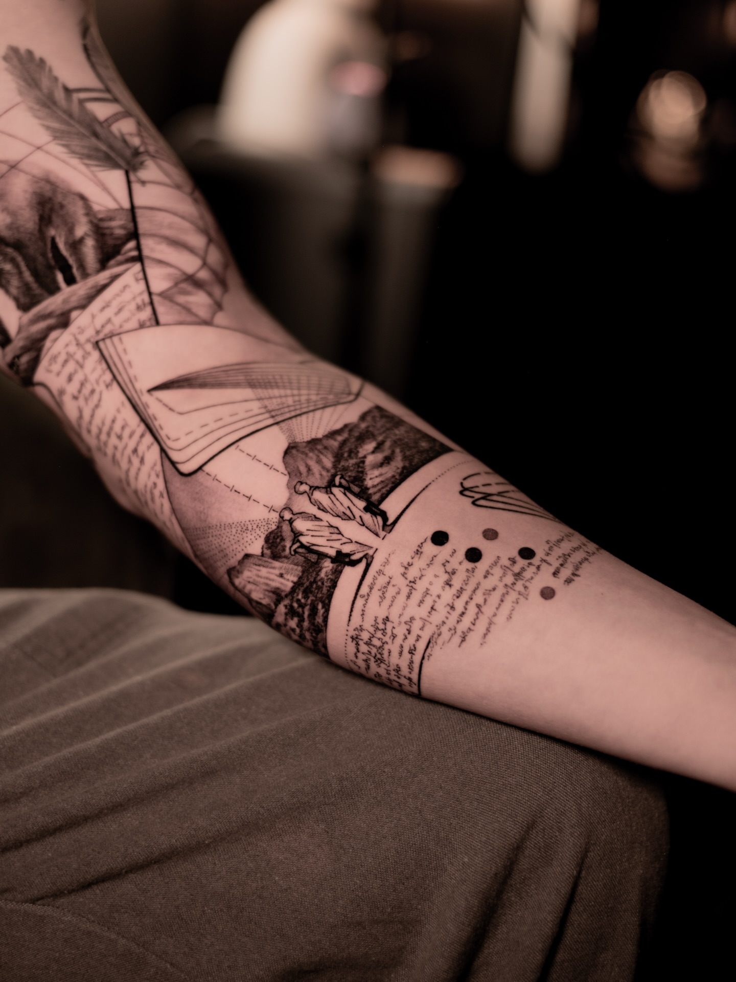 Book and flowers realism tattoo on the forearm by Mark D, Los Angeles, California